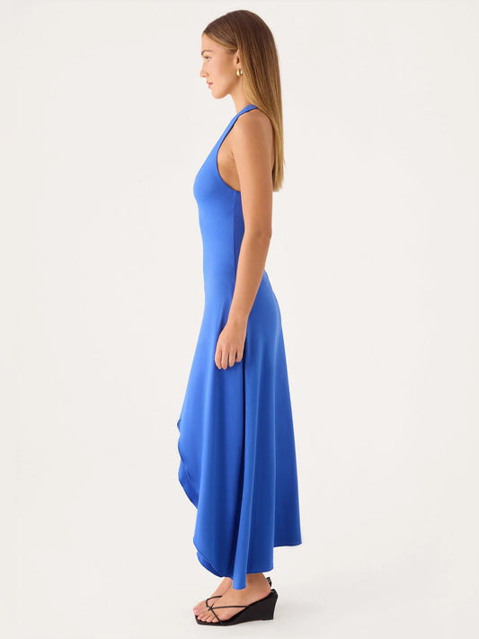 Cobalt blue midi dress side view with open back and asymmetrical high-low hem