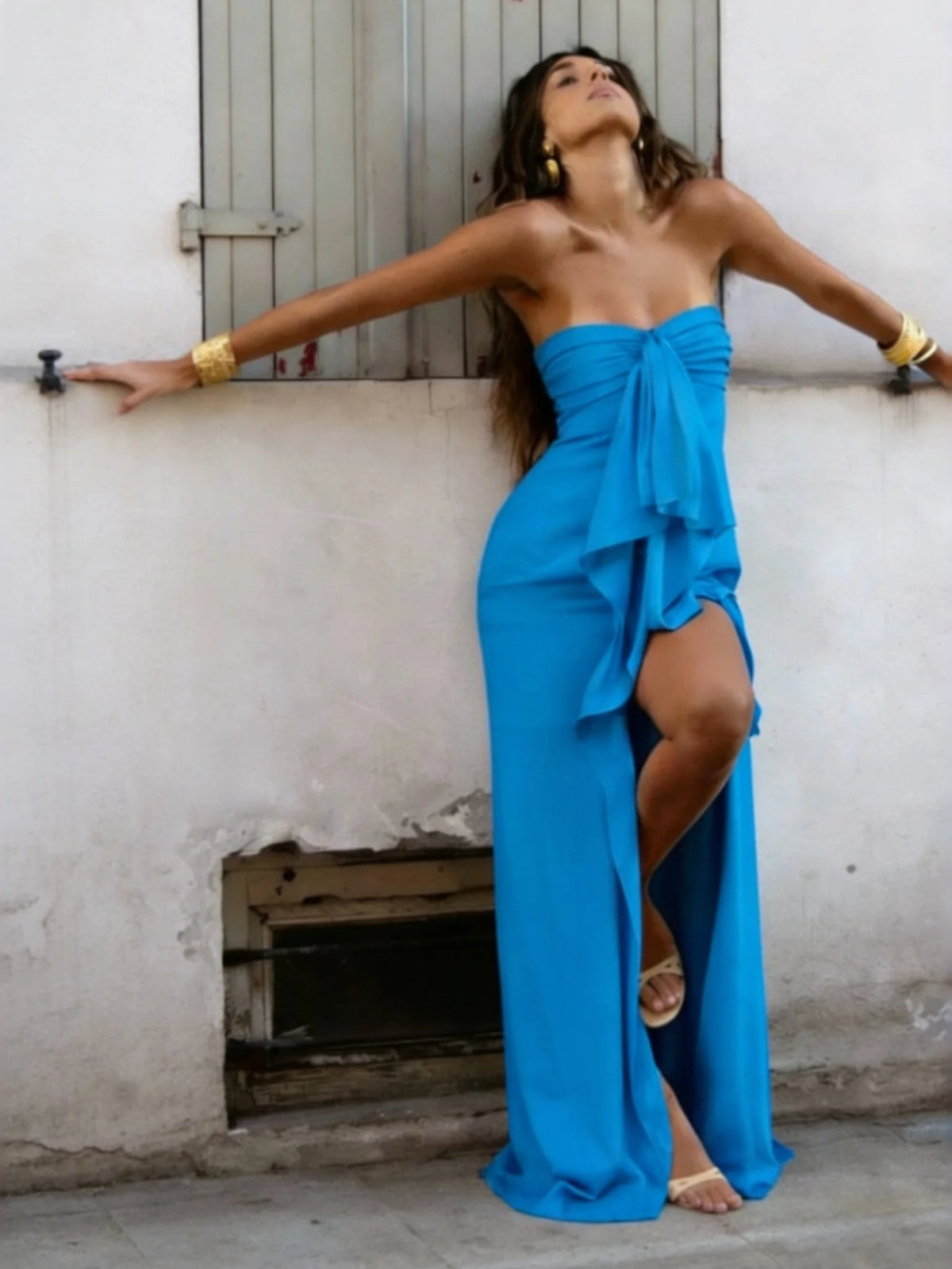 Teal blue strapless satin sheath prom dress with draped bow and high side slit, floor length