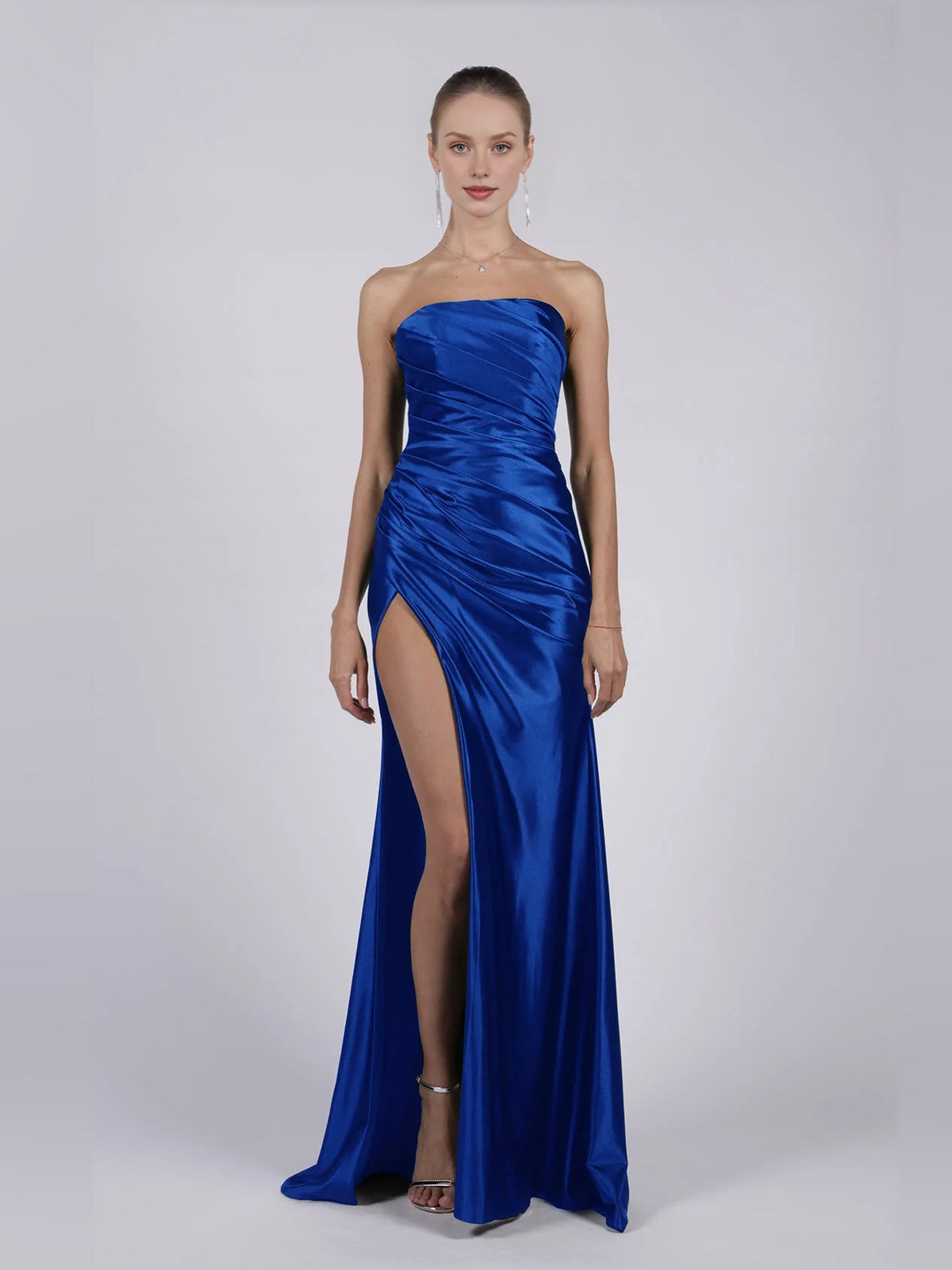 Strapless royal blue mermaid formal gown with ruched bodice and thigh-high slit