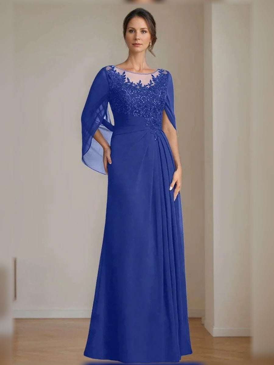 Floor-length mother of the bride dress in royal blue, illusion neckline and draped sleeves