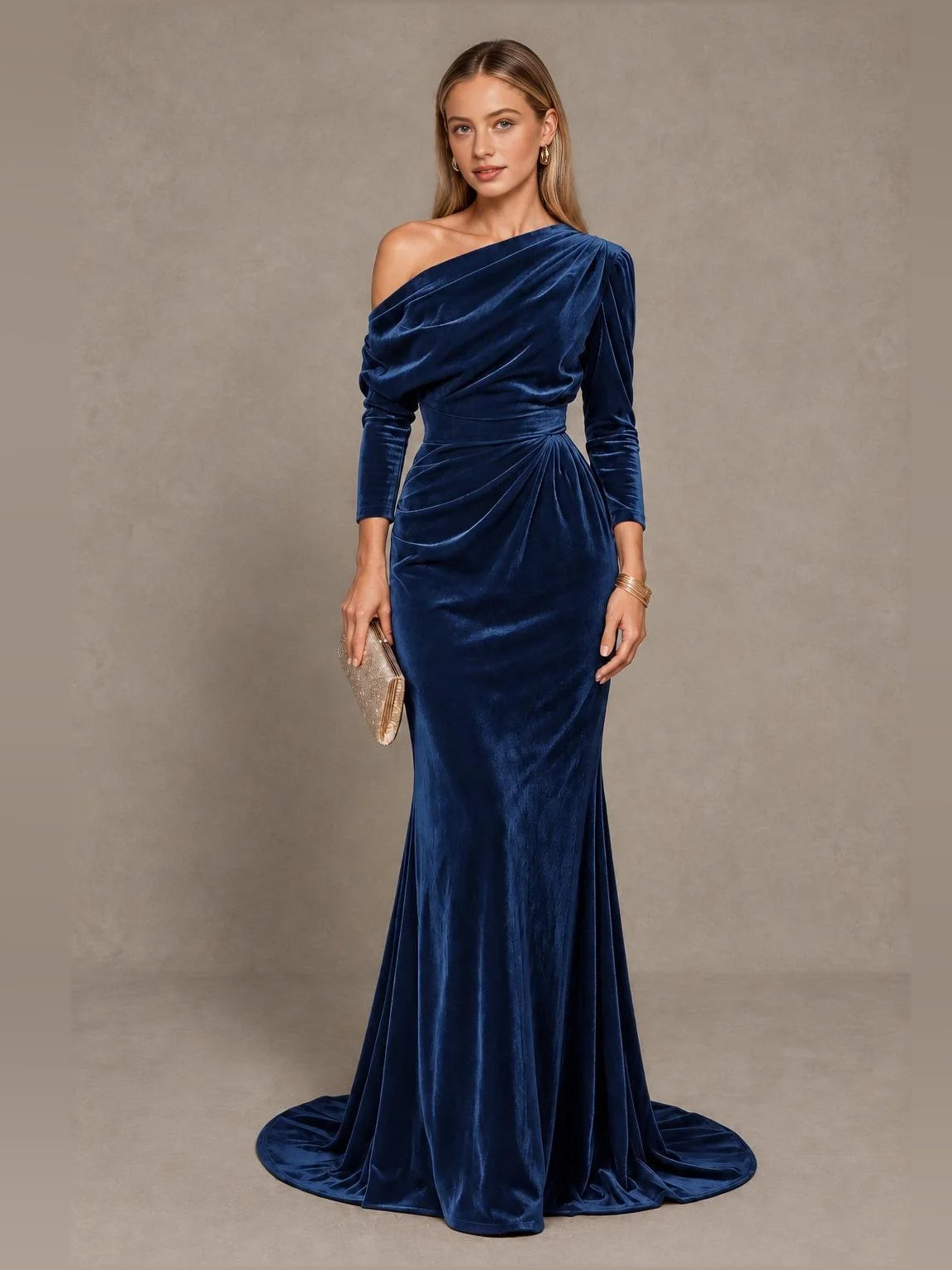Royal blue velvet one-shoulder mermaid gown with draped bodice and long sleeves