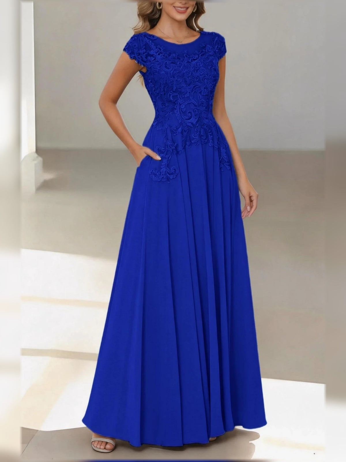 Royal blue satin floral A-line dress with bateau neck, cap sleeves, draped waist bow