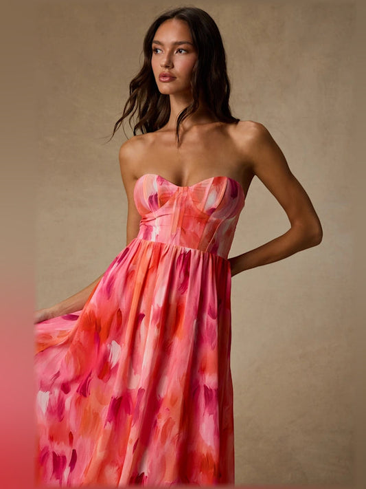 Coral pink abstract strapless bustier midi formal dress, front close-up with hand on hip