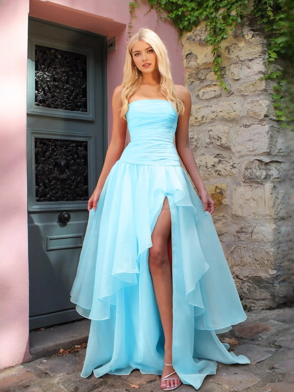 Light blue strapless A-line prom dress with ruched bodice and high-low front slit hem
