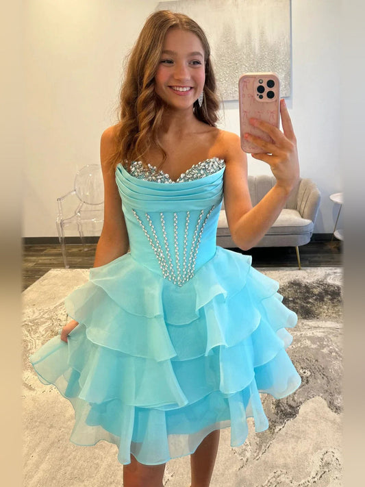 Ice blue sweetheart corset mini dress with tiered ruffled skirt and beadwork bodice