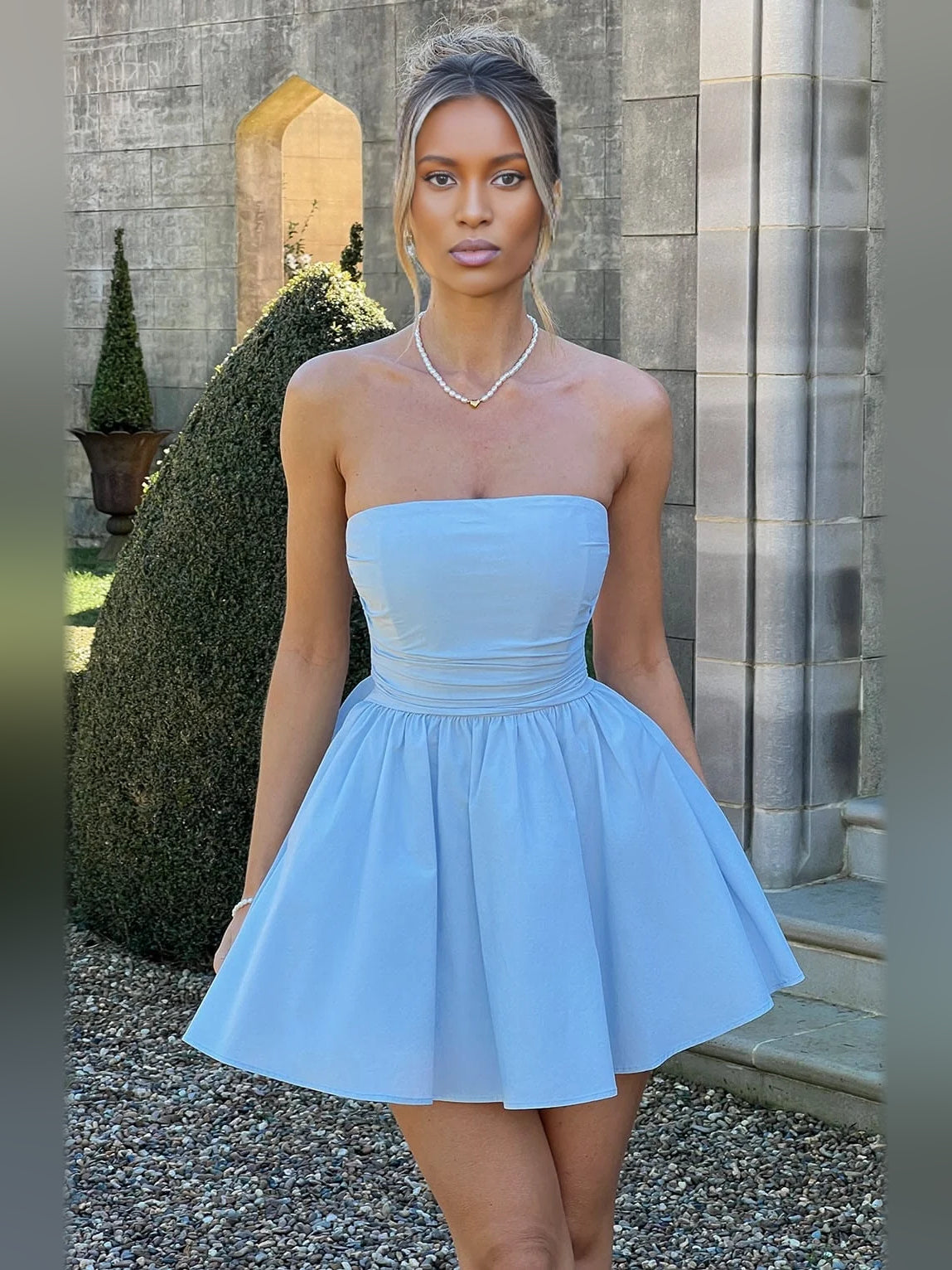 Light blue strapless A-line mini tulle dress with ruched bodice and flared skirt