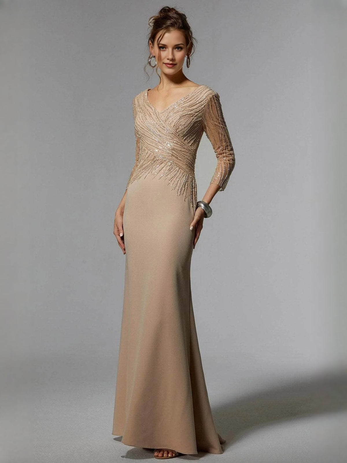 Champagne V-neck corset gown with allover beading and fitted floor-length silhouette