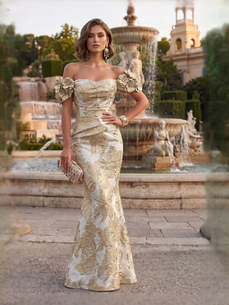 Front view off-shoulder mermaid evening dress in champagne with floral applique and ruched bodice