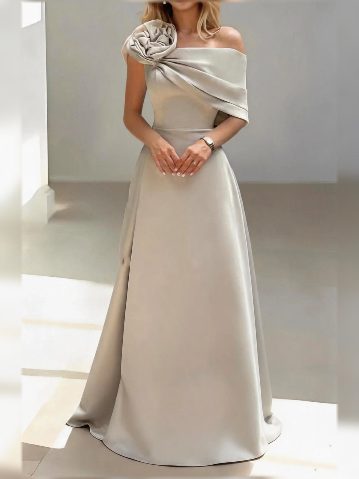 Champagne satin one-shoulder A-line gown with draped rosette neckline and long skirt