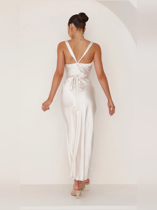 Champagne satin open-back maxi dress with crisscross straps and draped back detail
