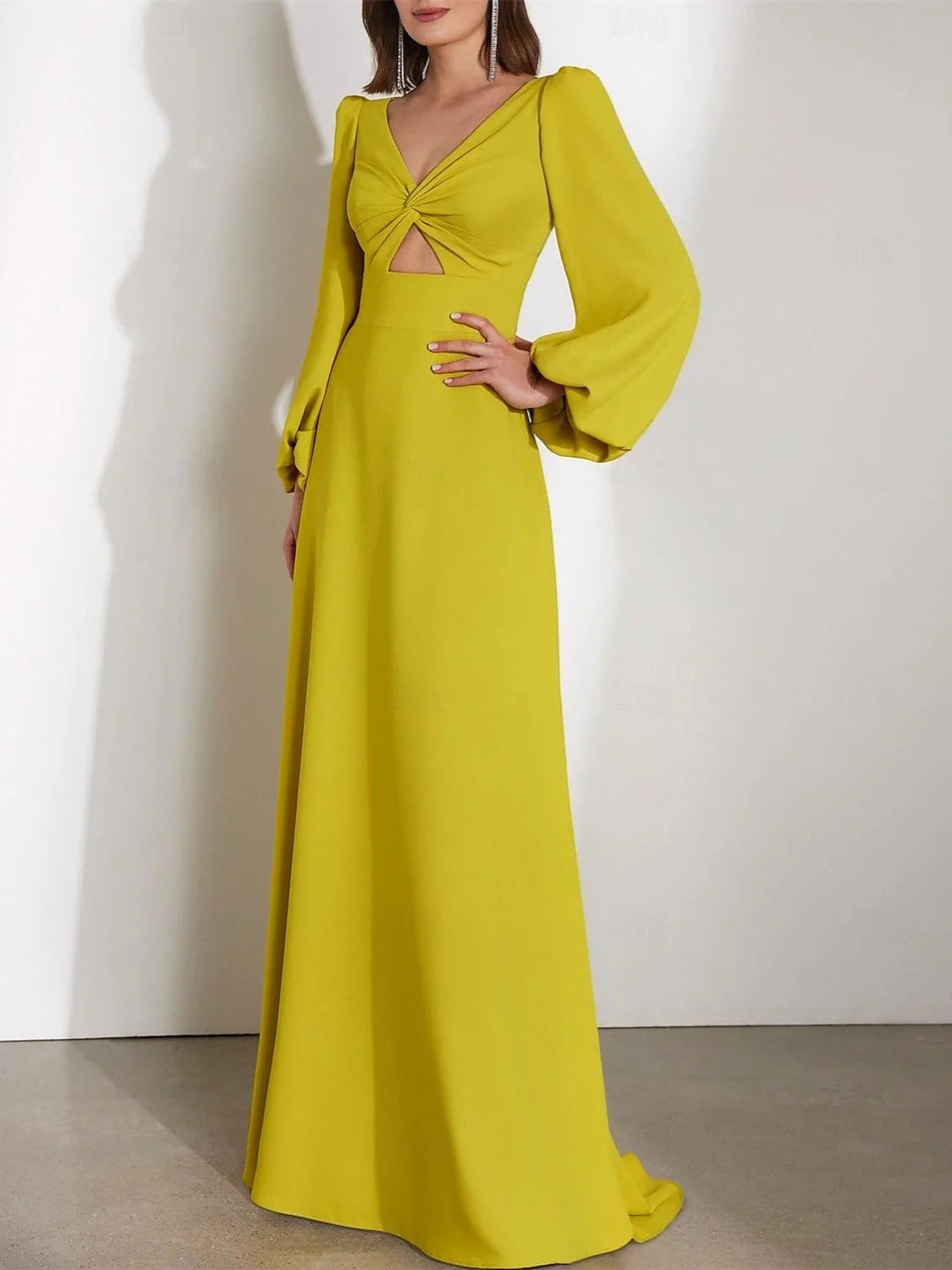 Chartreuse crepe V-neck A-line gown with cut-out bust detail and long bell sleeves