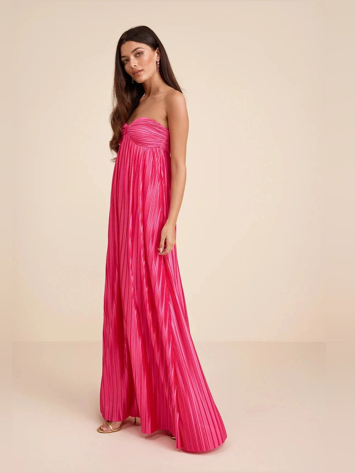 Hot pink satin strapless bridesmaid dress with ruched bodice and pleated maxi column