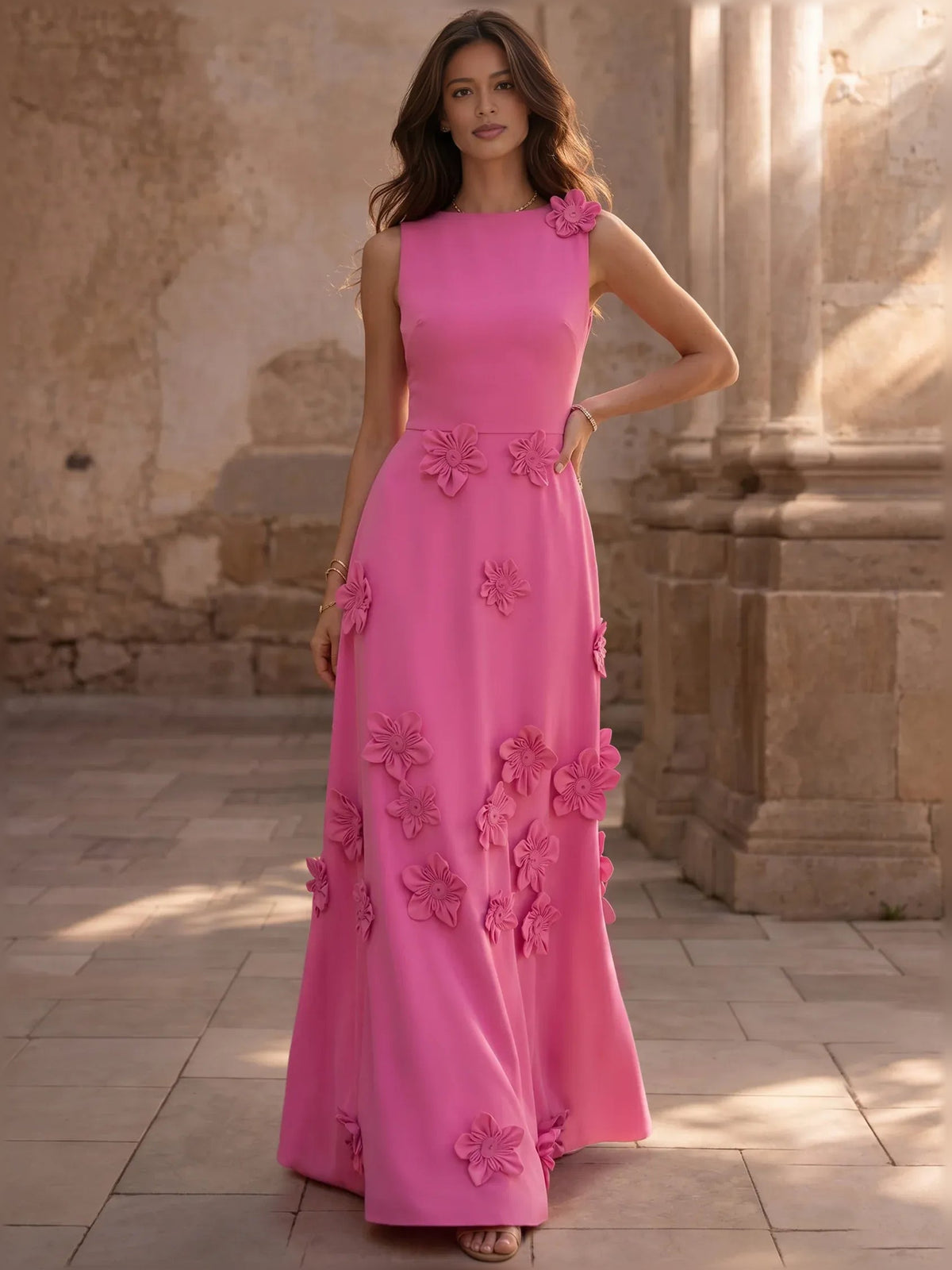 Pink sleeveless floor-length A-line formal dress with floral appliqués