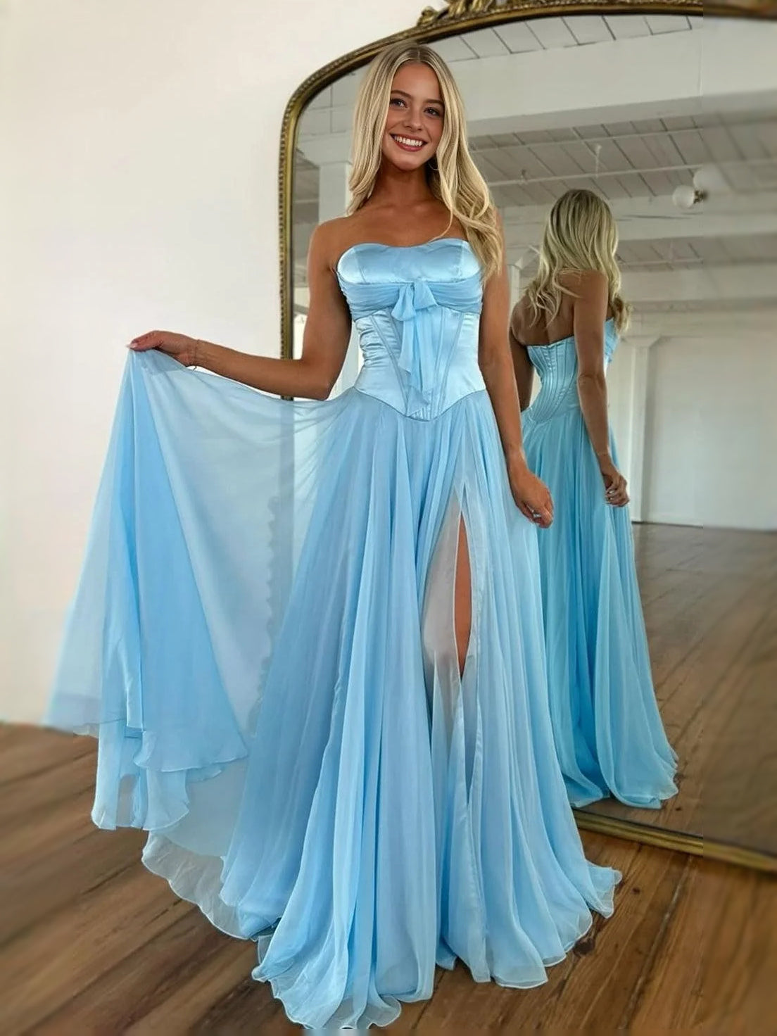 Light blue strapless corset prom dress with bow bodice and chiffon skirt with slit