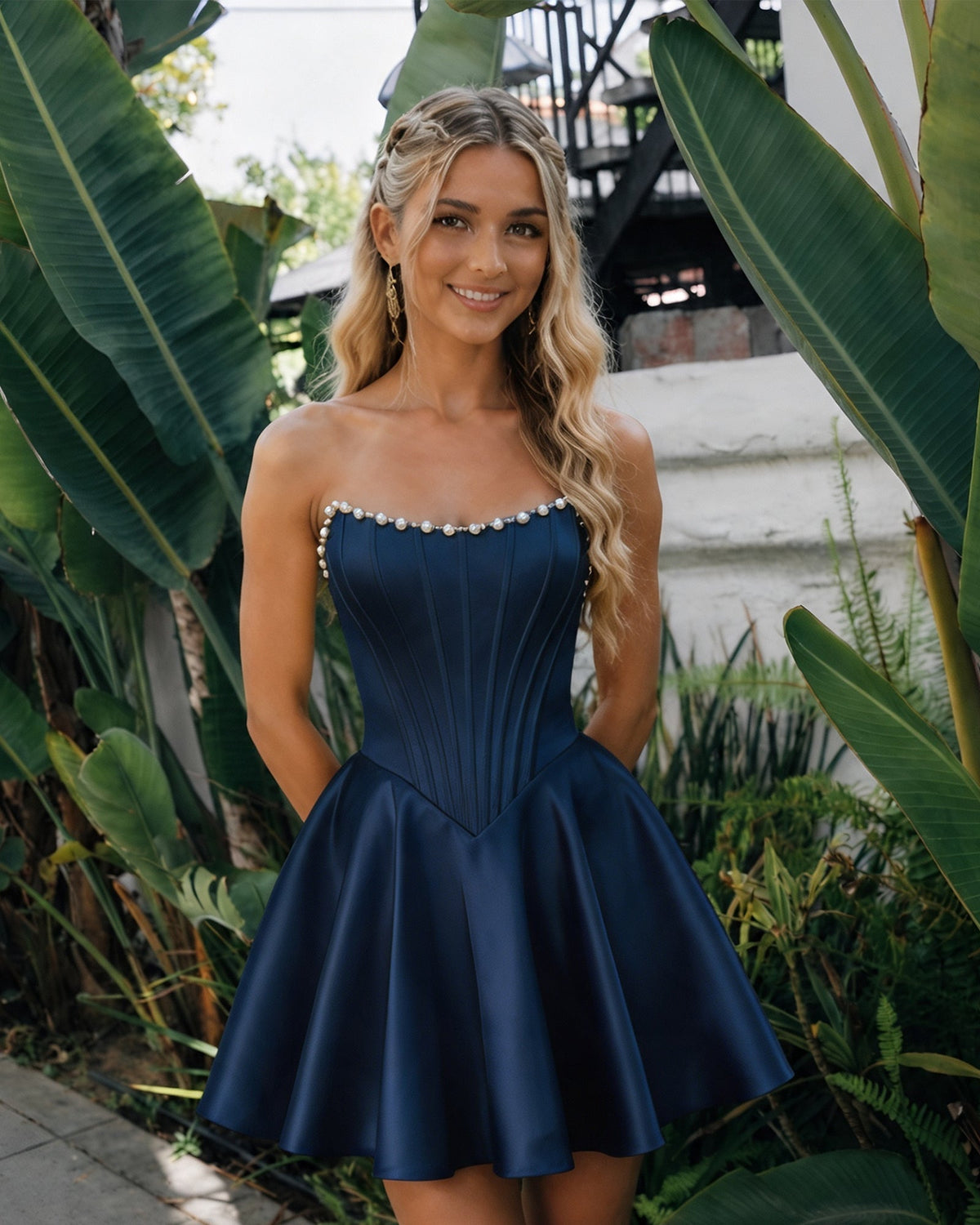 Navy satin strapless corset dress with pearl trim and flared homecoming skirt