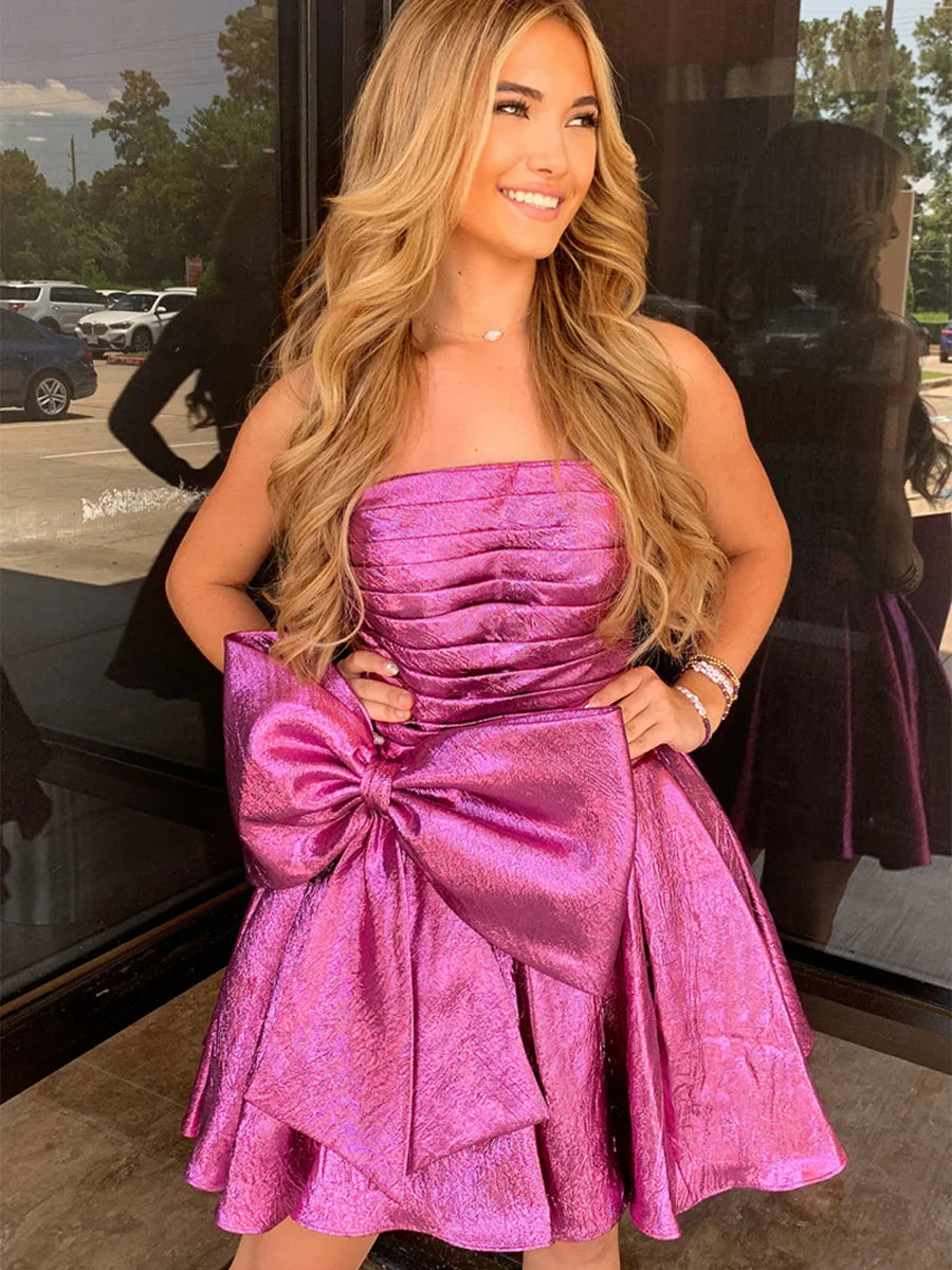 Pink strapless ruched A-line mini homecoming dress with layered skirt and bow detail