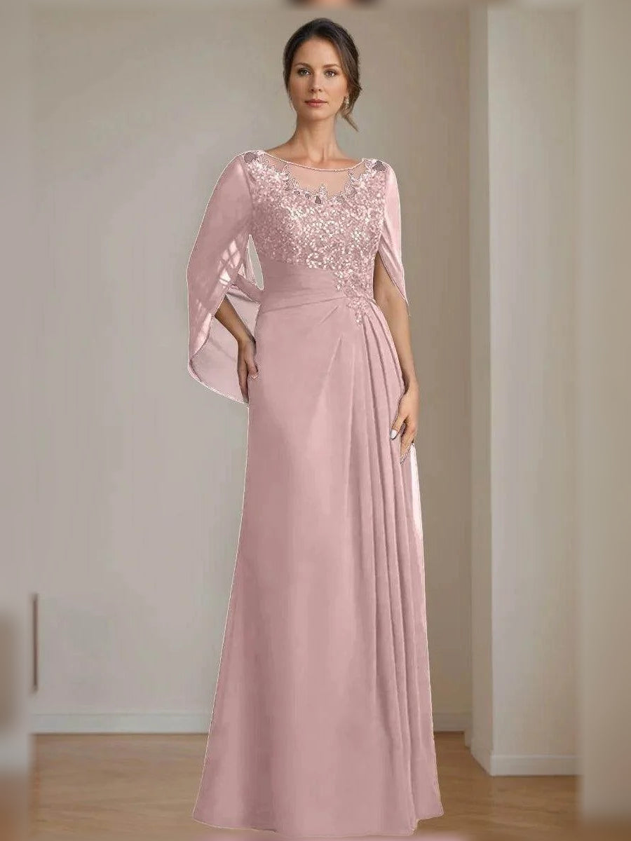 Floor-length mother of the bride dress in pale pink, illusion neckline and draped sleeves