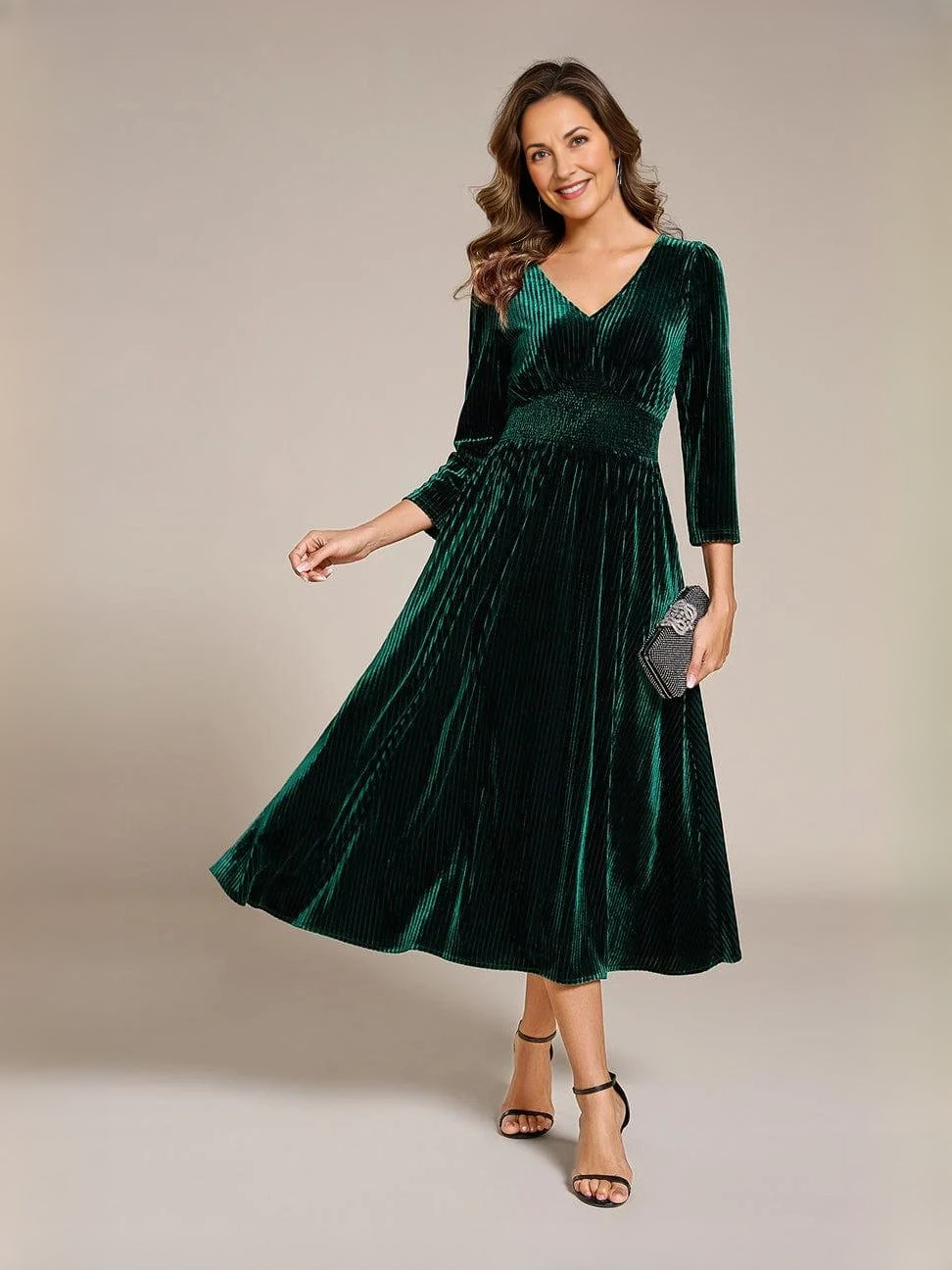 Dark green velvet V-neck A-line midi dress, front view with long sleeves