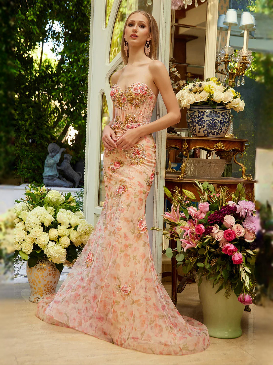 Peach floral sweetheart mermaid prom dress with long flared skirt and fitted waist