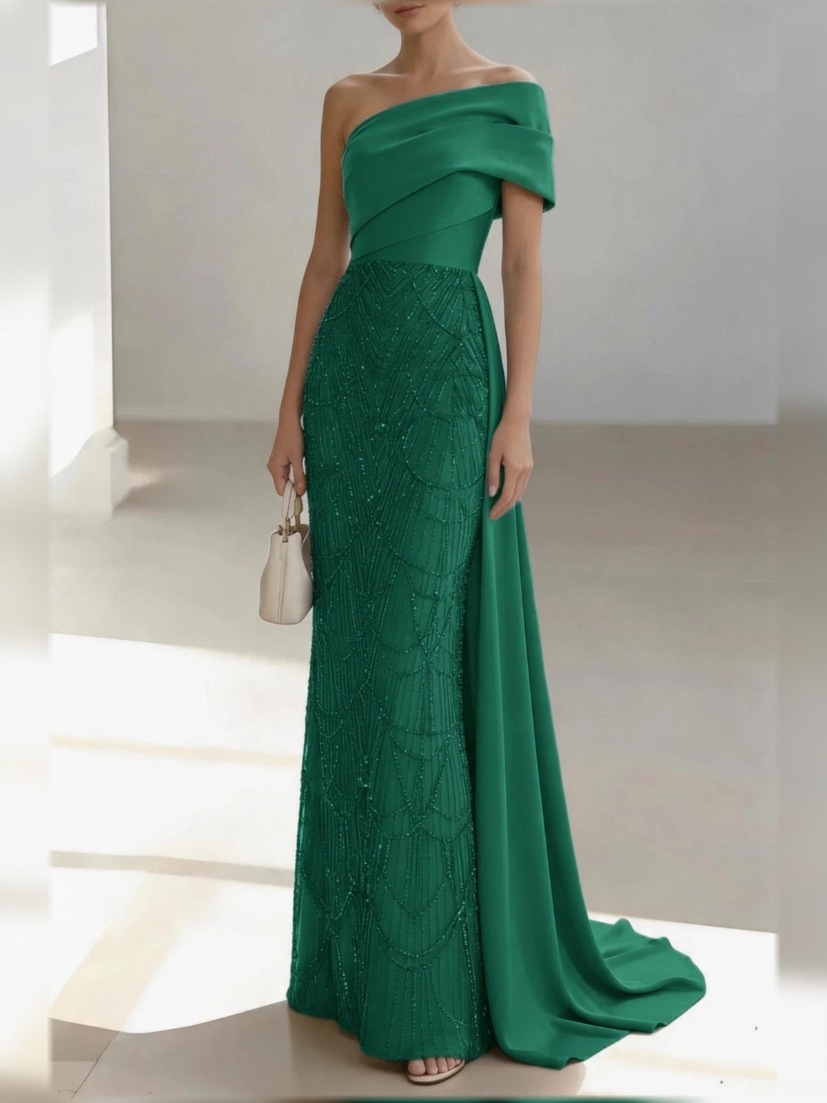 Emerald green one-shoulder mermaid gown with draped bow, floor-length satin