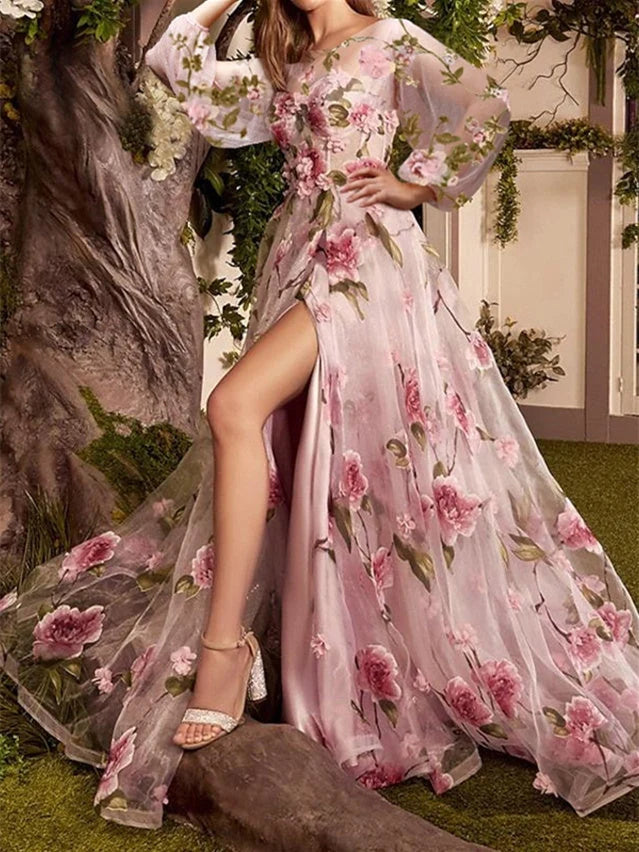 Pink floral A-line prom dress with illusion neckline, long sleeves, floor length and side slit