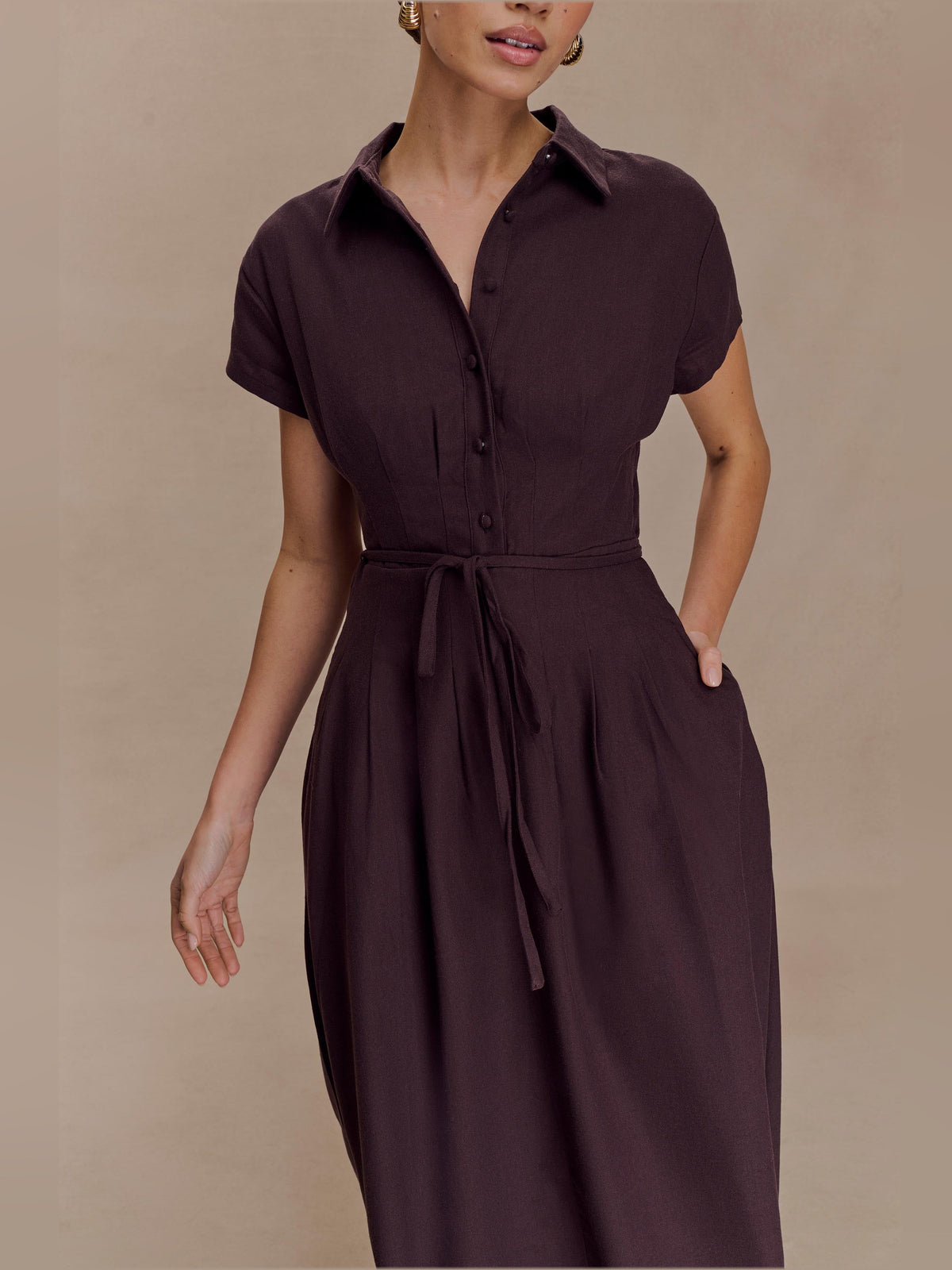 Chocolate linen midi dress with short sleeves, button front, and tied waist belt