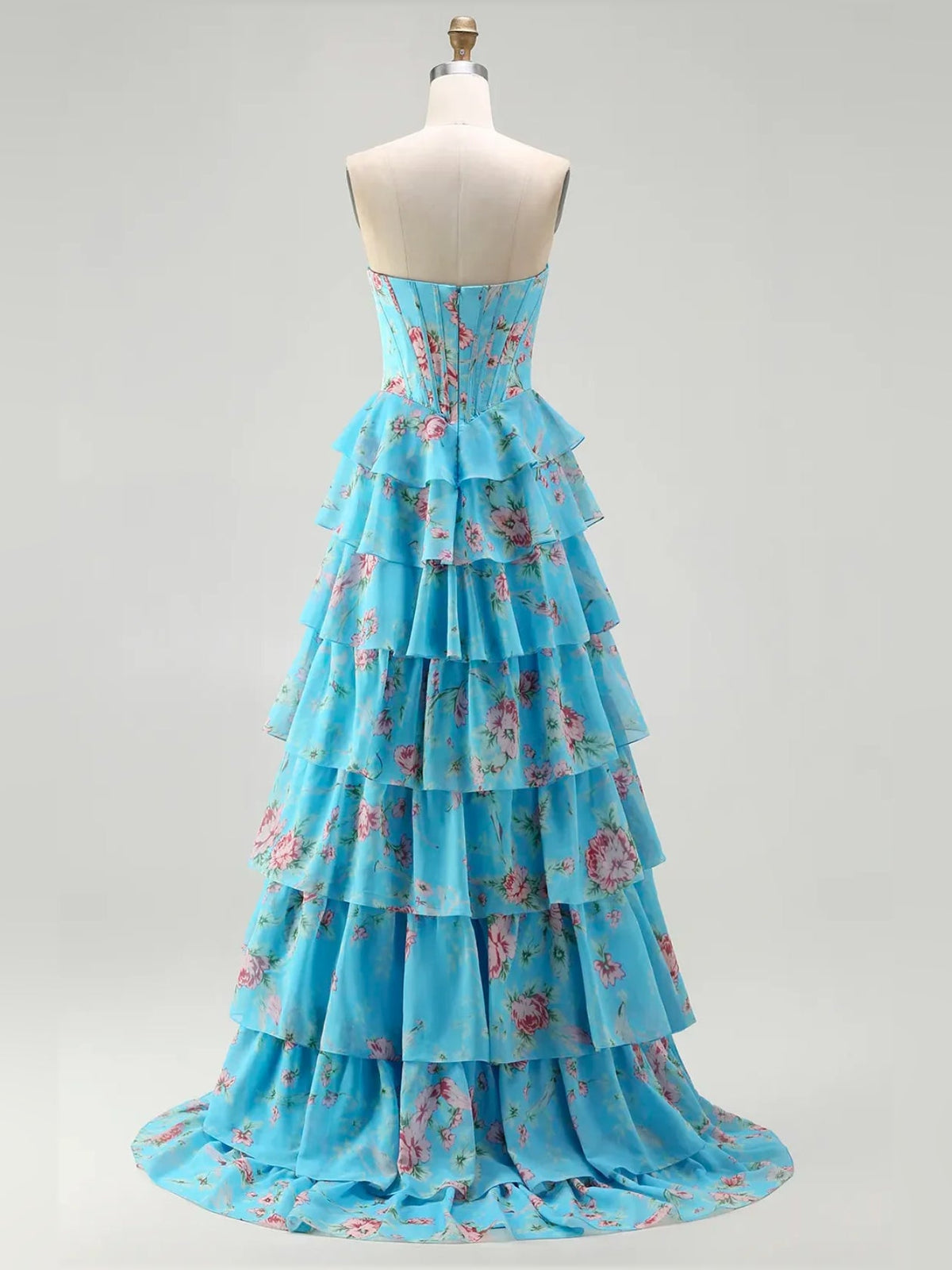 Turquoise floral tiered ruffle strapless A-line prom dress on a mannequin.
