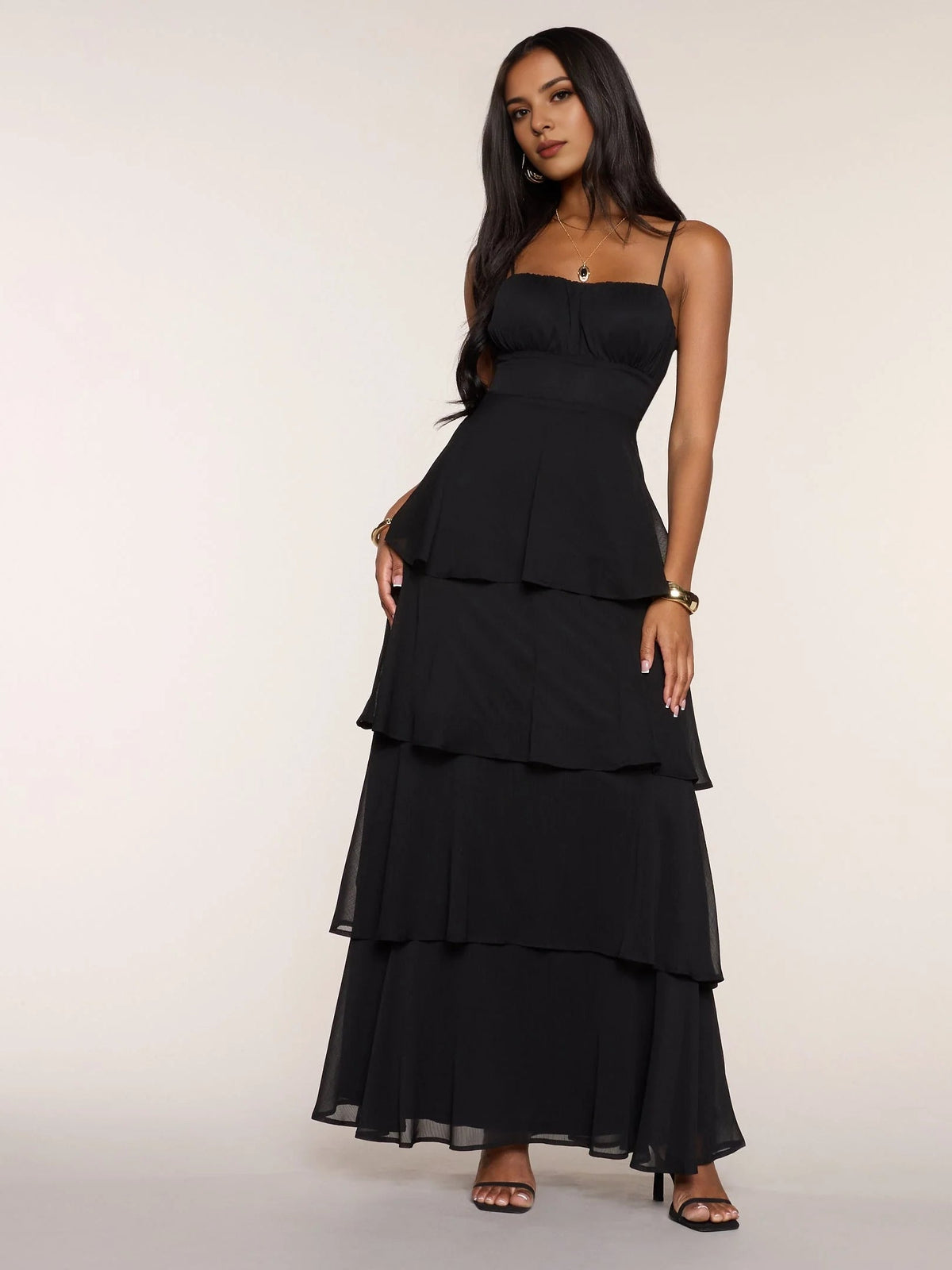 Black chiffon prom dress with spaghetti straps and tiered ruffle skirt