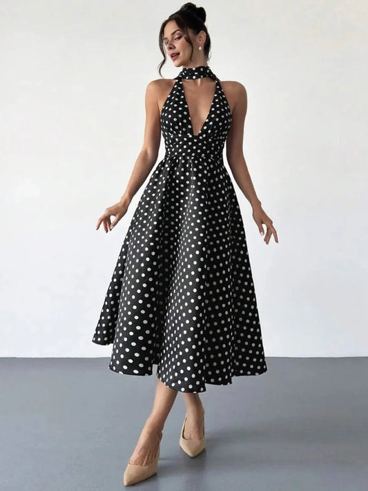 Black and white polka dot V-neck midi A-line dress with halter choker and open back