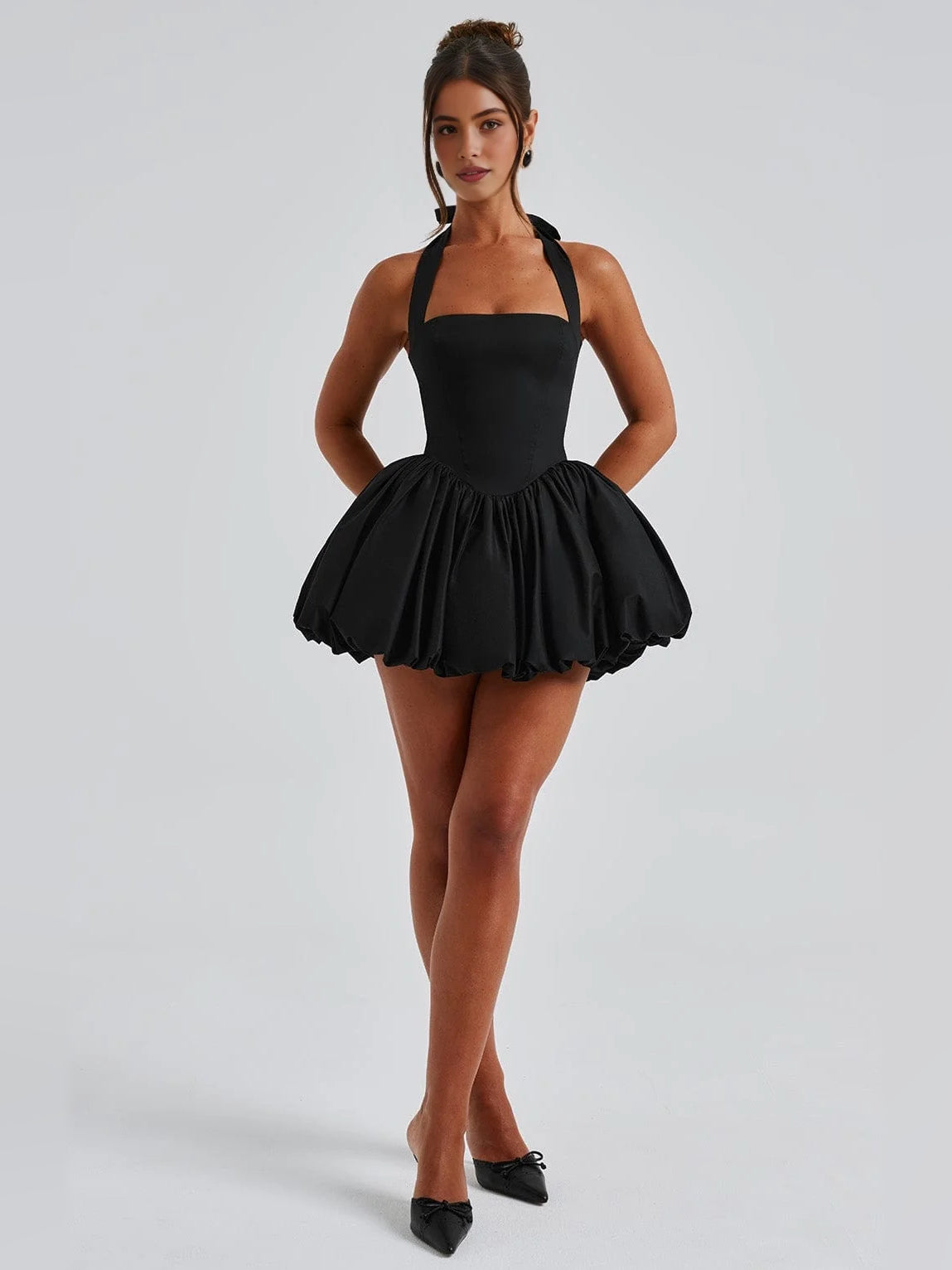 Black mini dress with halter corset-style bodice and gathered flared ruffle skirt