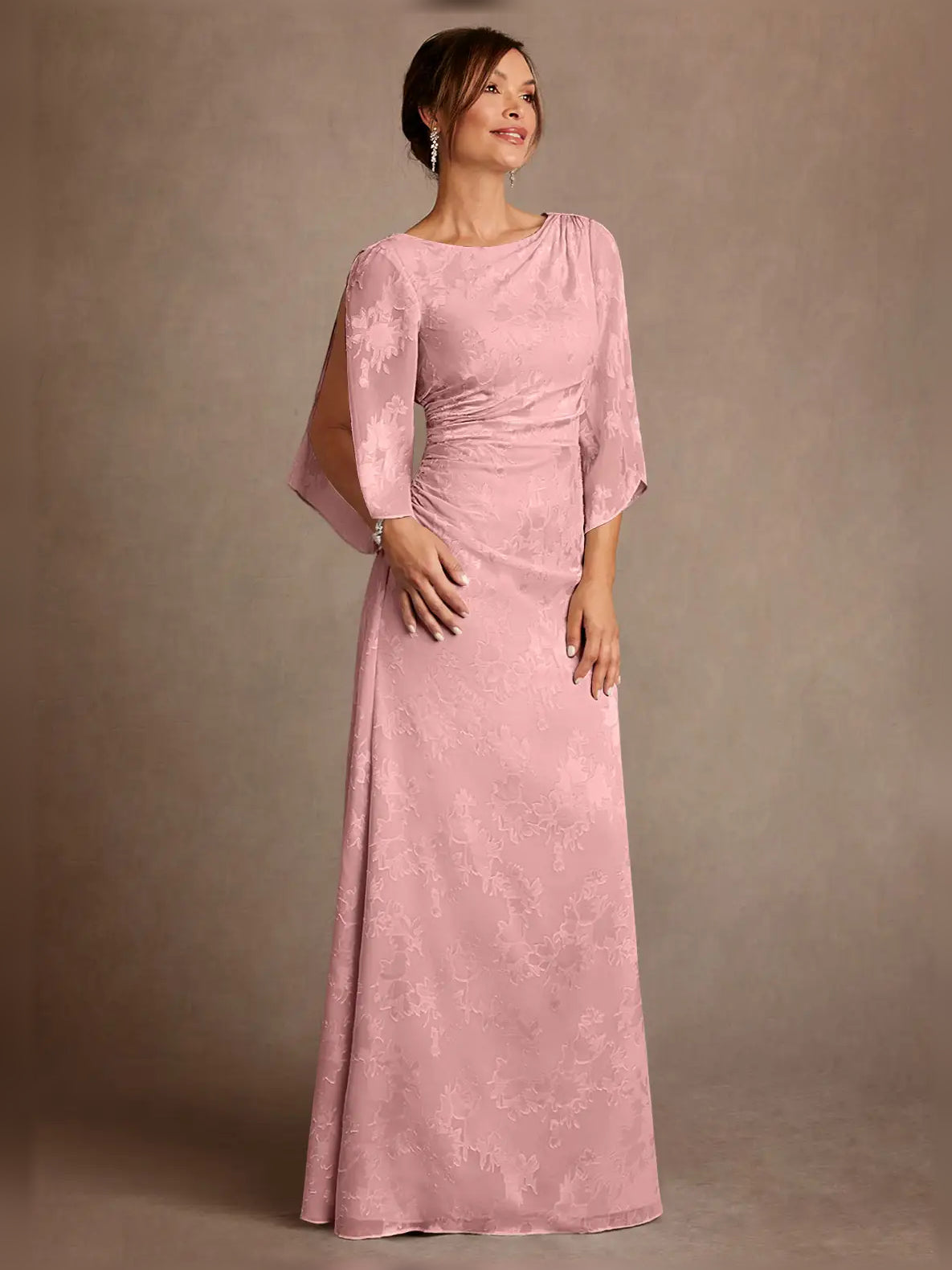 Light pink ruched draped bateau neck column gown with 3/4 sleeves, floor length.