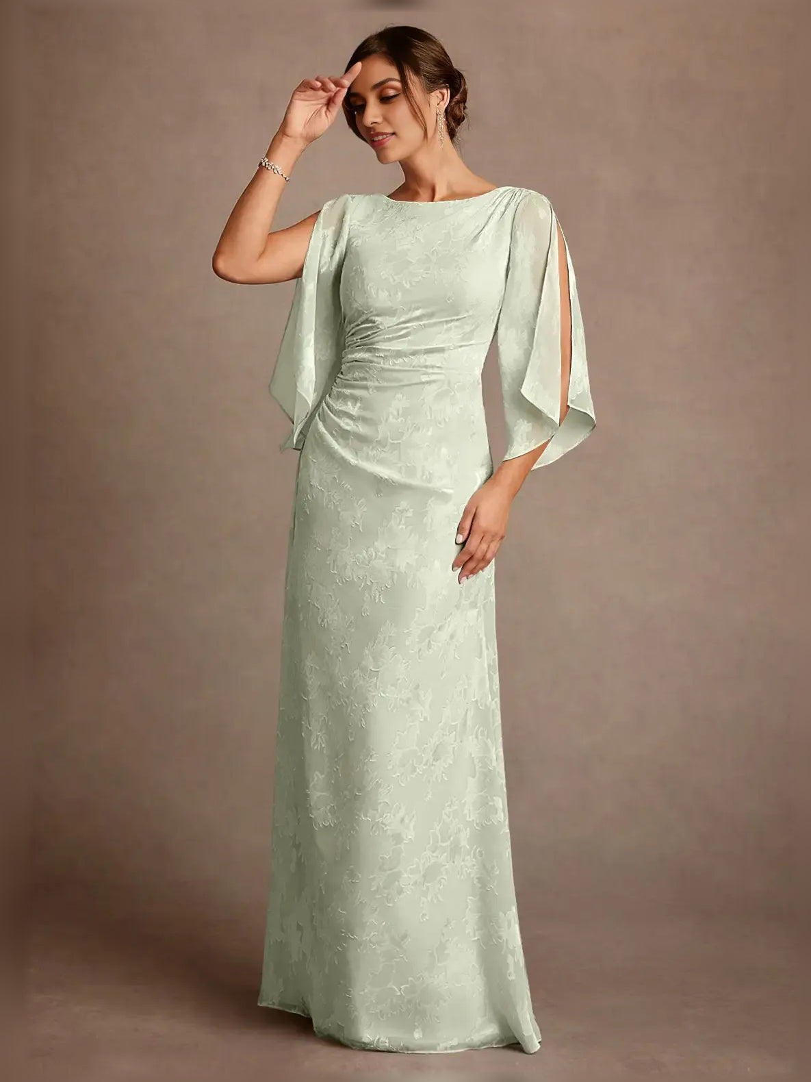 Mint green draped column dress with ruched bodice and cape sleeve drapes