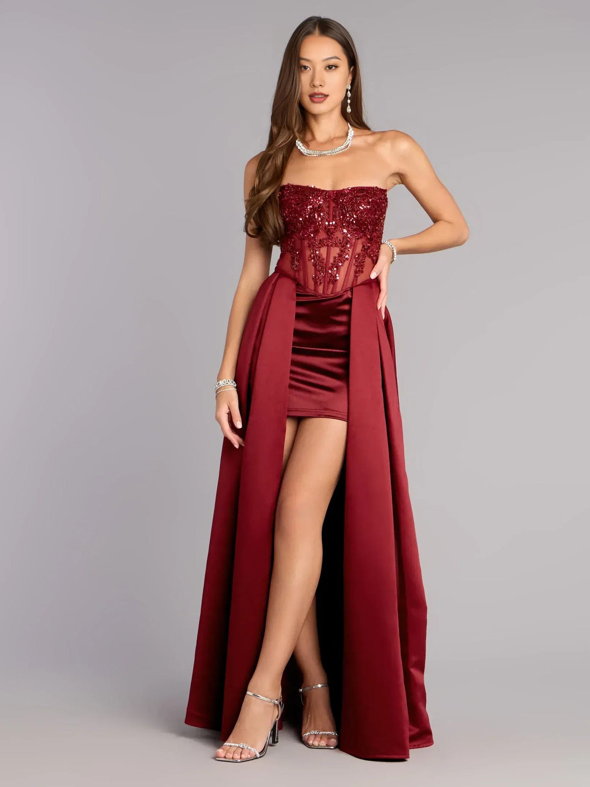 Burgundy strapless beaded mini formal dress with thigh slit and draped skirt