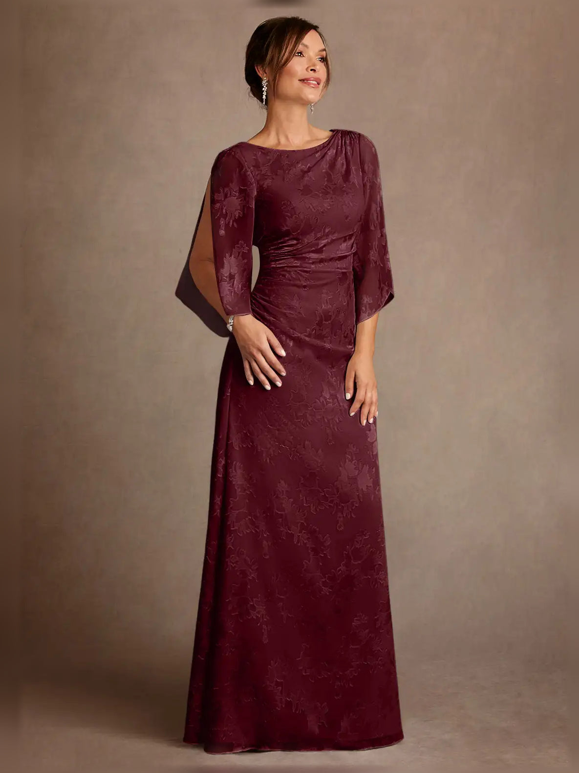 Burgundy ruched draped bateau neck column gown with 3/4 sleeves, floor length.