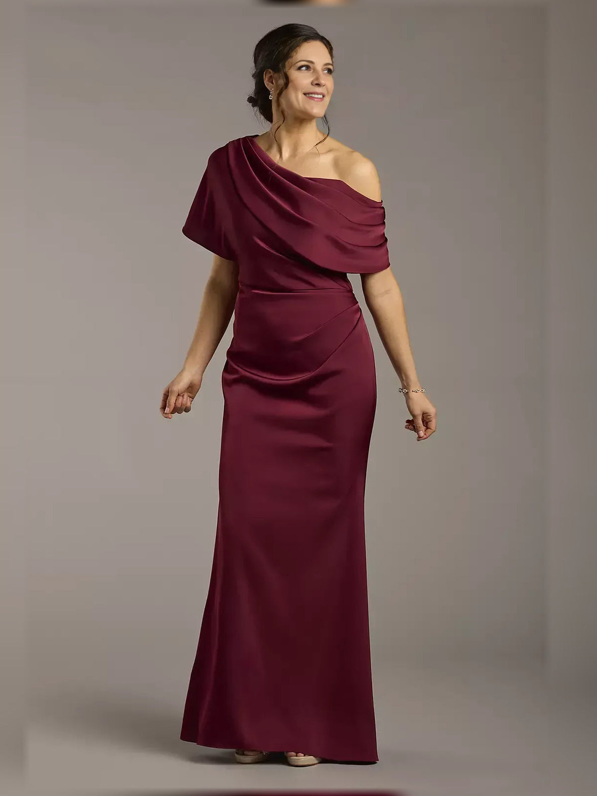 Burgundy one-shoulder satin sheath dress with draped ruffle detail, floor-length