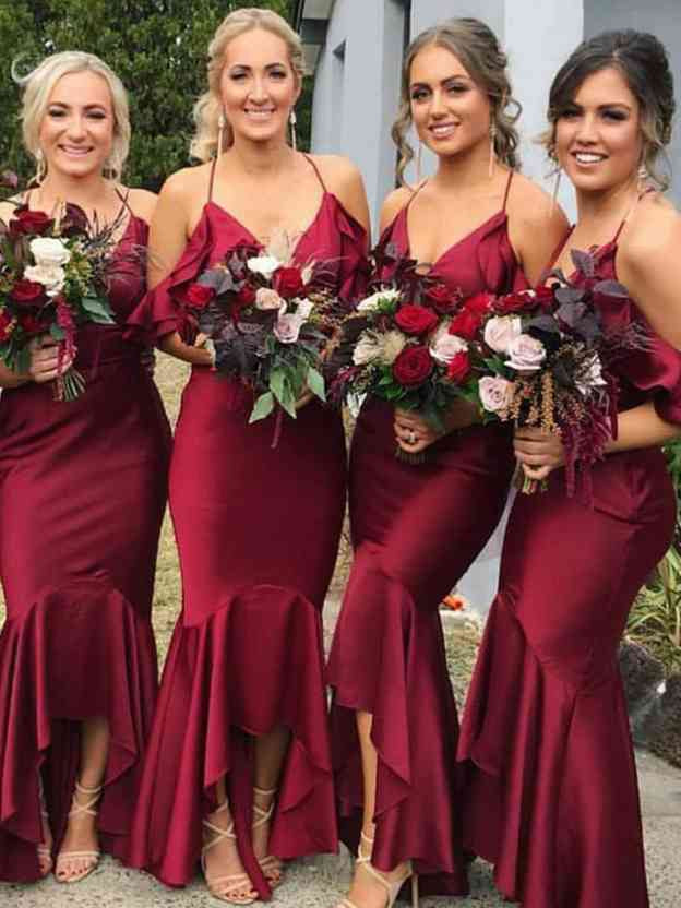 Burgundy V-neck mermaid bridesmaid dress with fitted waist and flared floor-length skirt