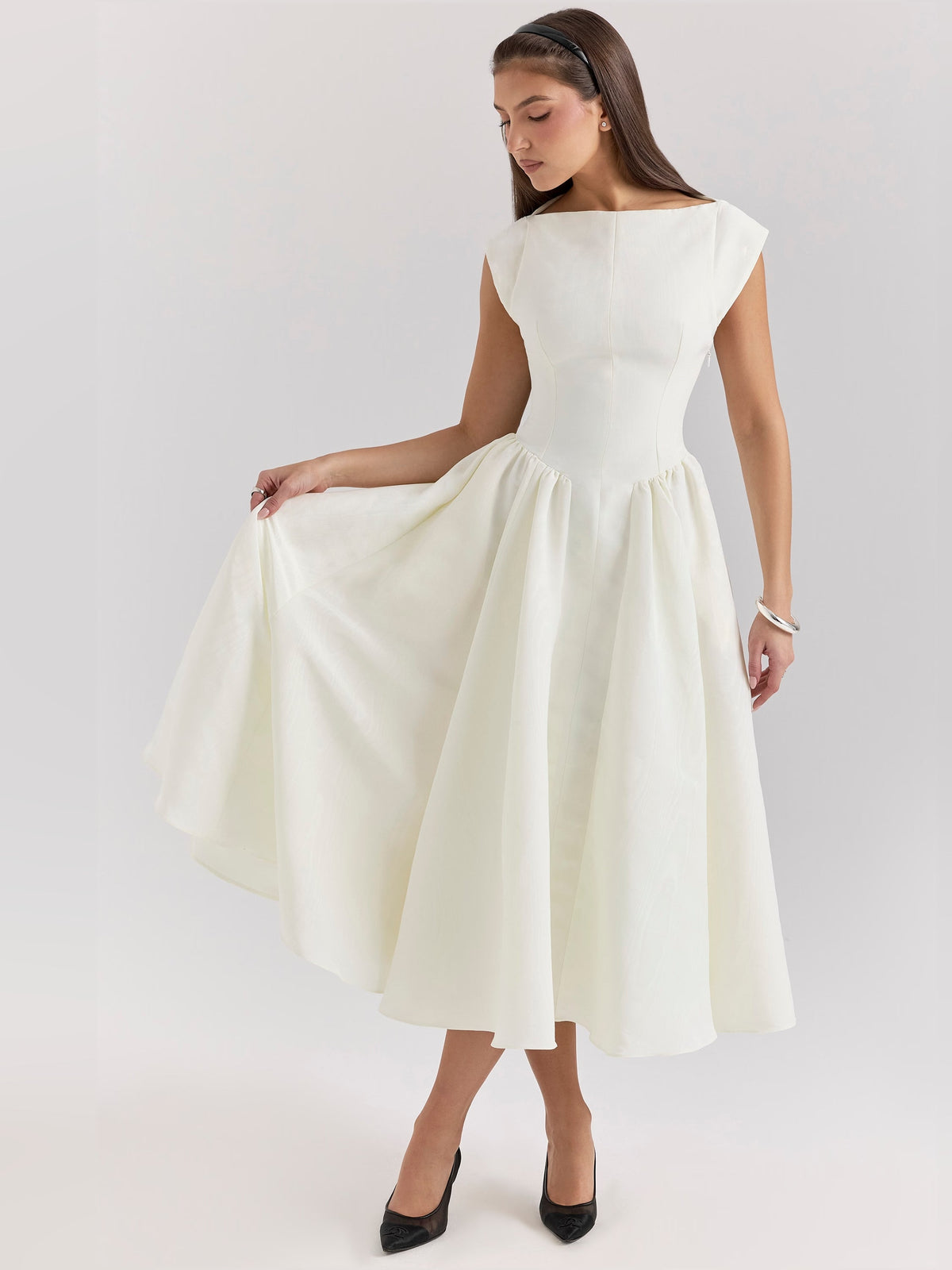 Ivory midi dress with cap sleeves and scoop neckline, side drape and gathered skirt