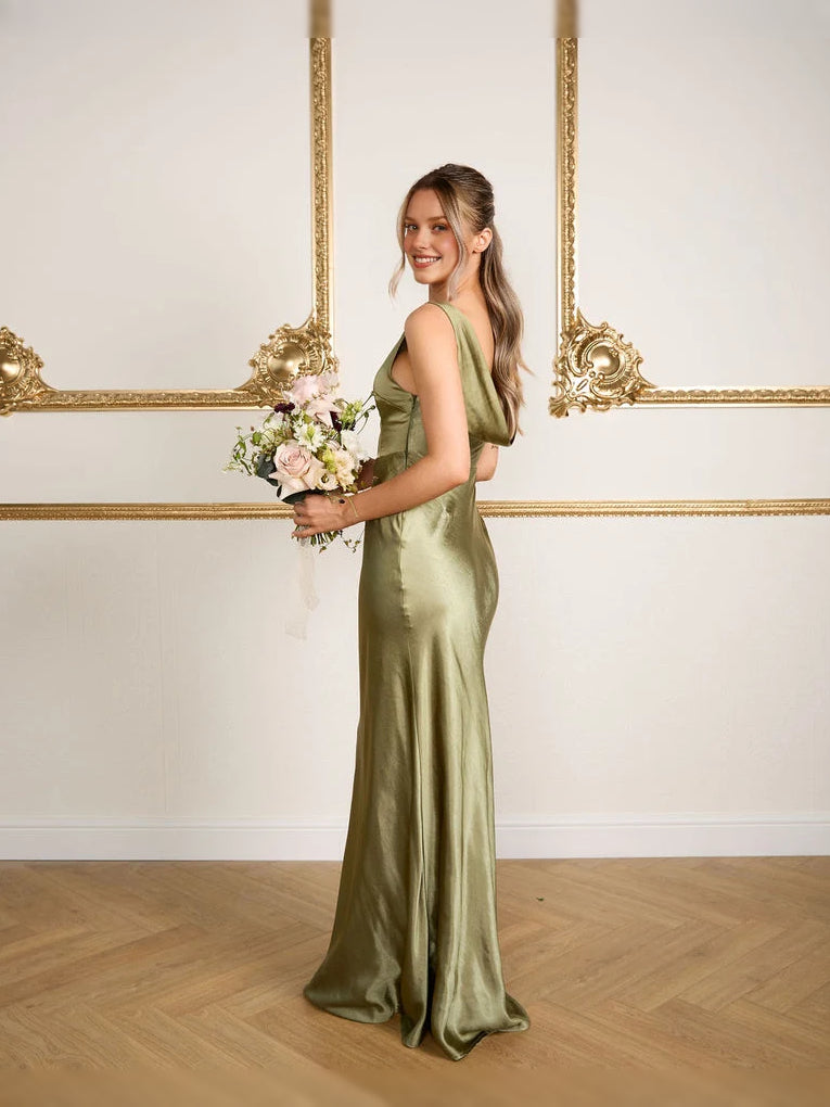 Moss green cowl-neck mermaid bridesmaid dress, sleeveless, floor-length, holding bouquet