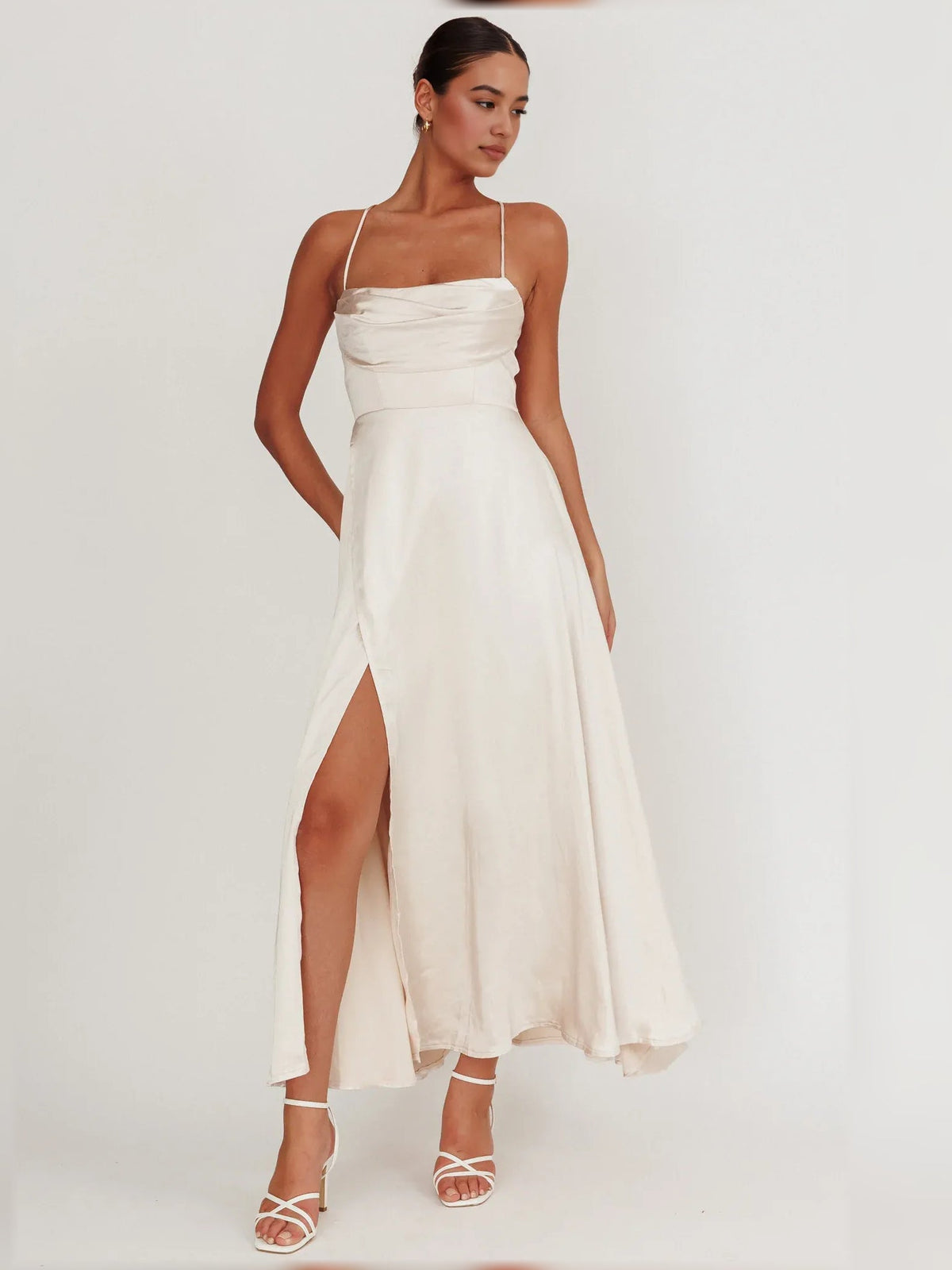 Cream cowl-neck maxi dress with spaghetti straps and high side slit
