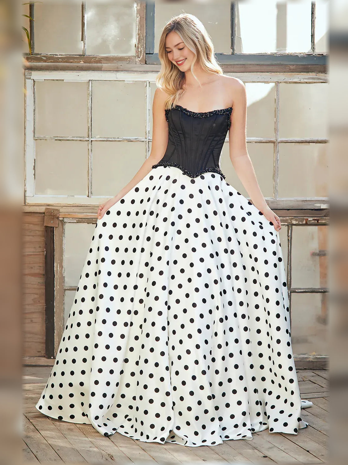 Sweetheart corset formal dress with black corset and white polka-dot floor-length skirt