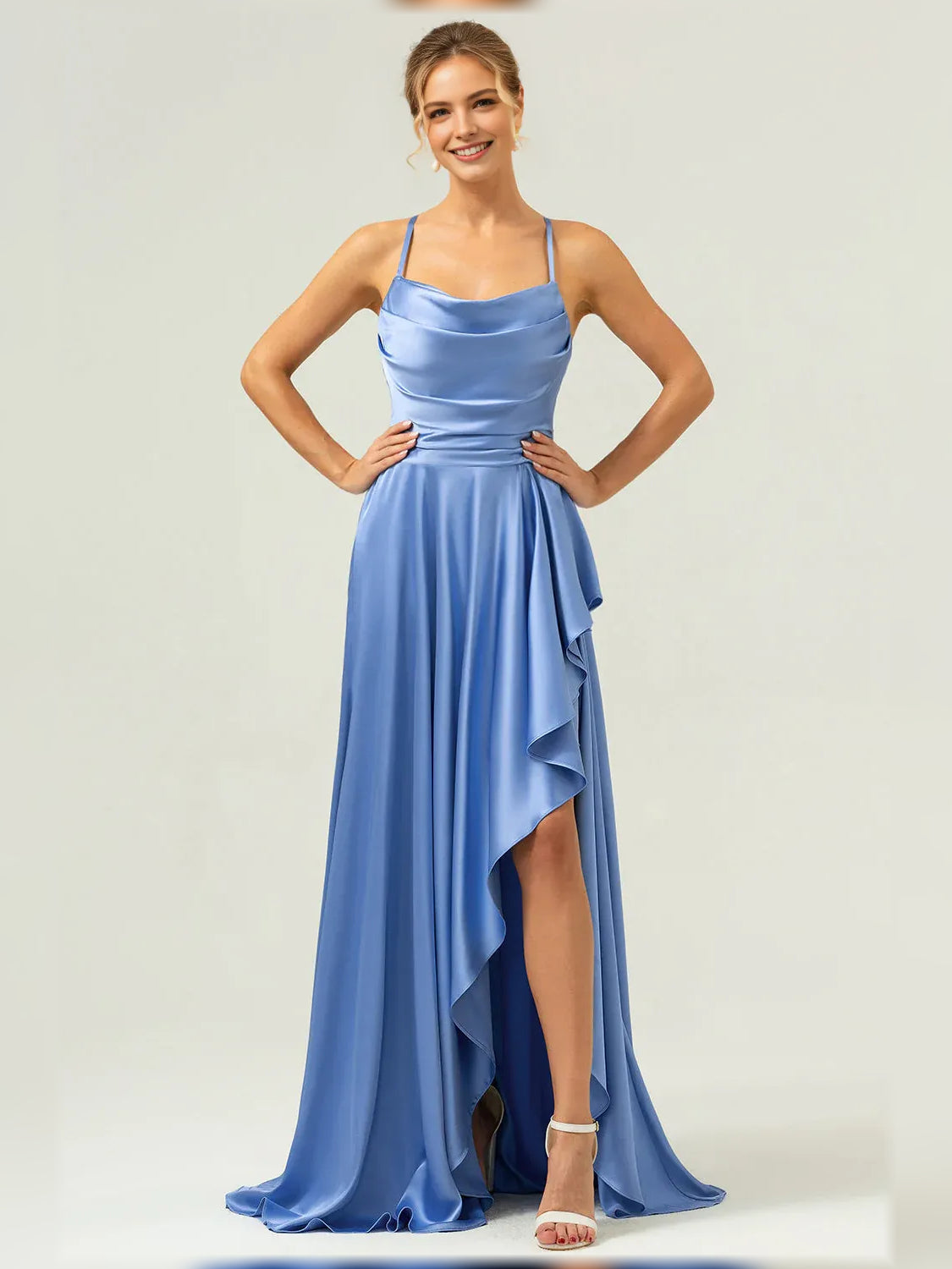 Blue formal satin maxi dress with cowl neckline, spaghetti straps, and ruffle side slit