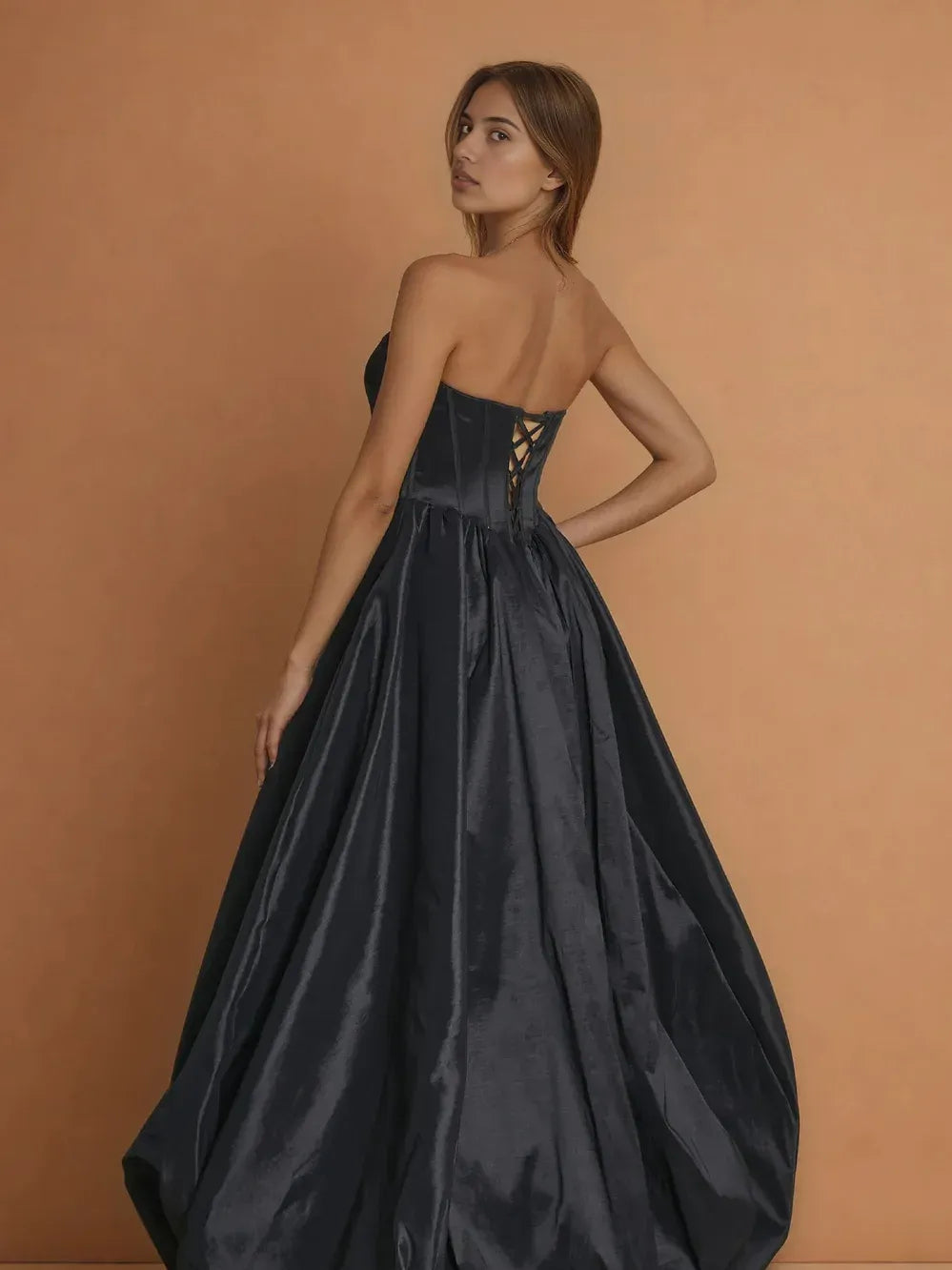 Black strapless corset formal dress with crisscross open back and full skirt