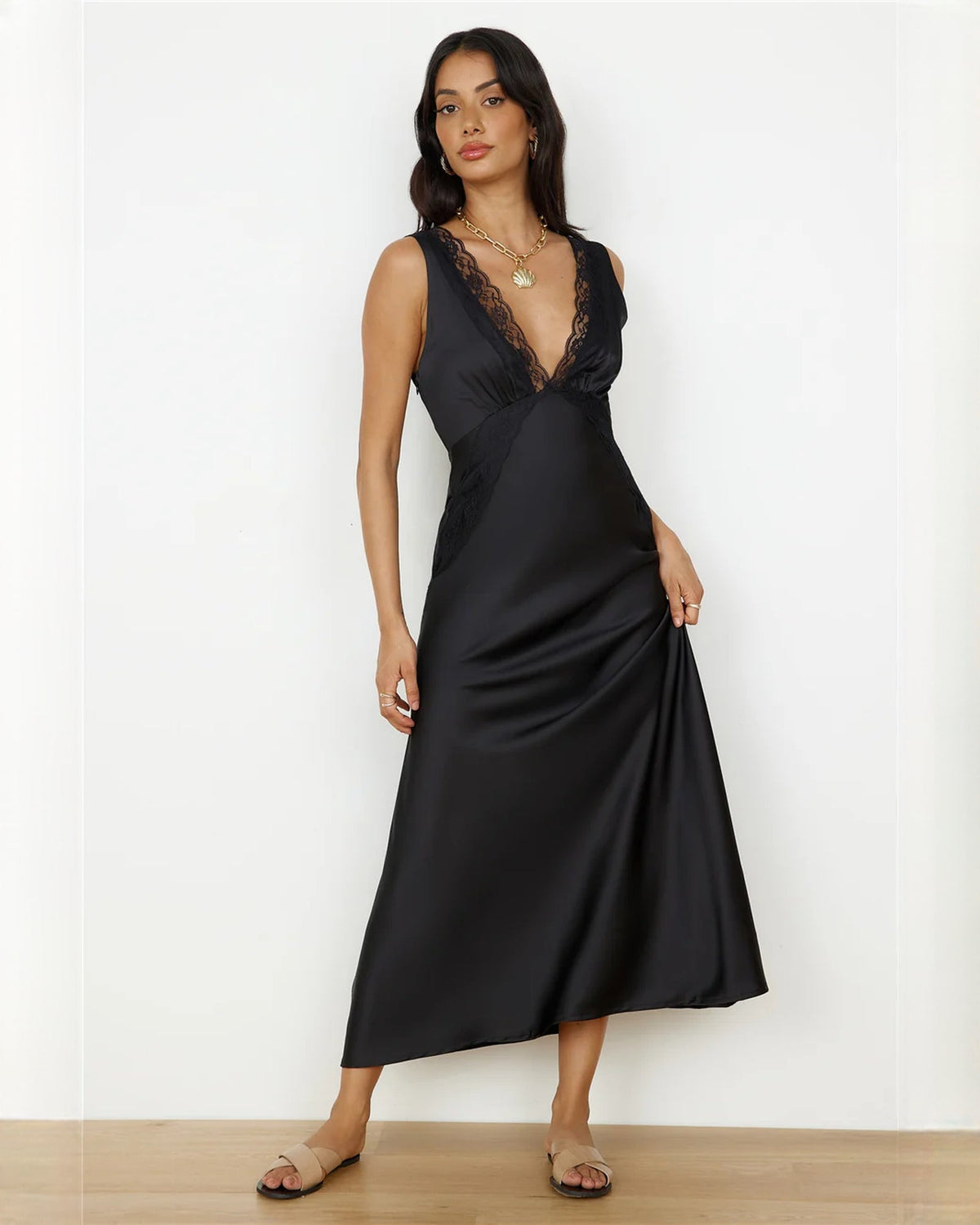 Black satin A-line dress with lace V-neck and sleeveless bodice
