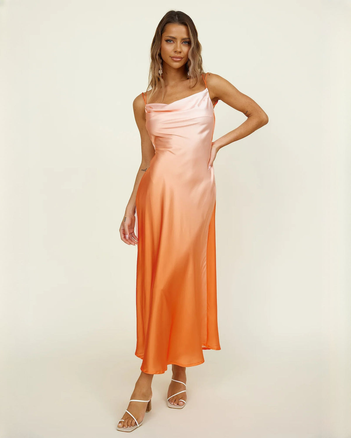 Peach orange satin A-line maxi bridesmaid dress with spaghetti straps and side drape