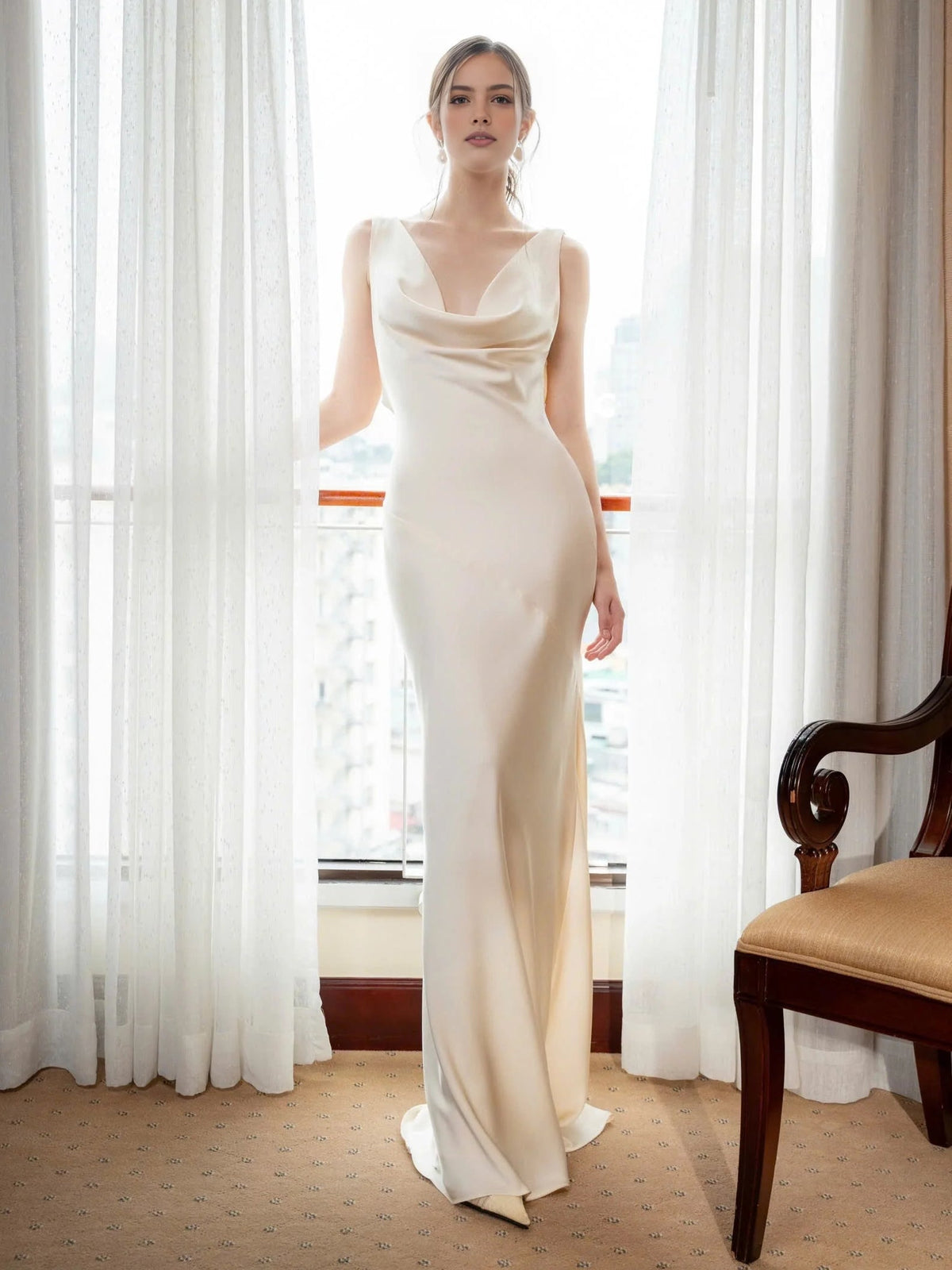 Champagne satin mermaid prom dress with draped cowl neck and fitted floor-length skirt
