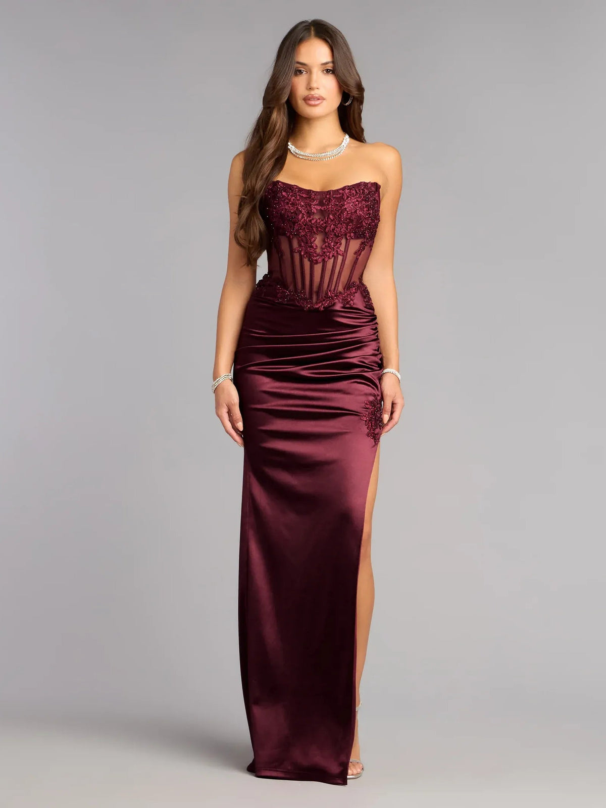 Strapless wine satin column gown with appliqué bodice and side slit