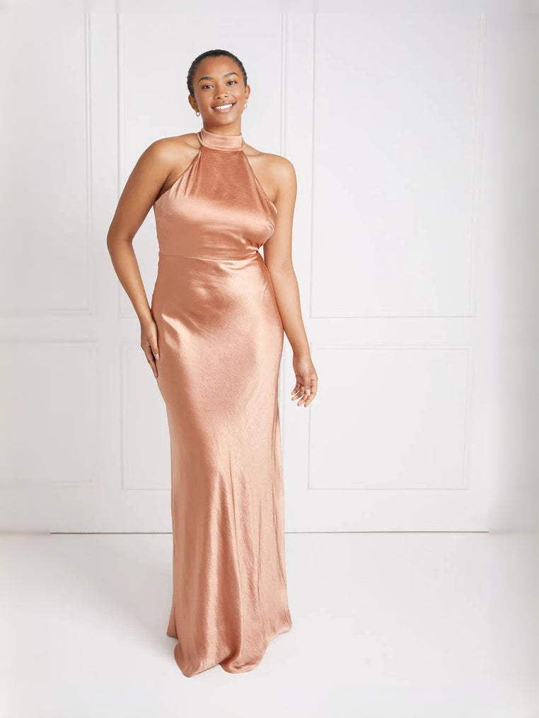 Peach satin halter-neck column dress with sleeveless halter and floor-length hem