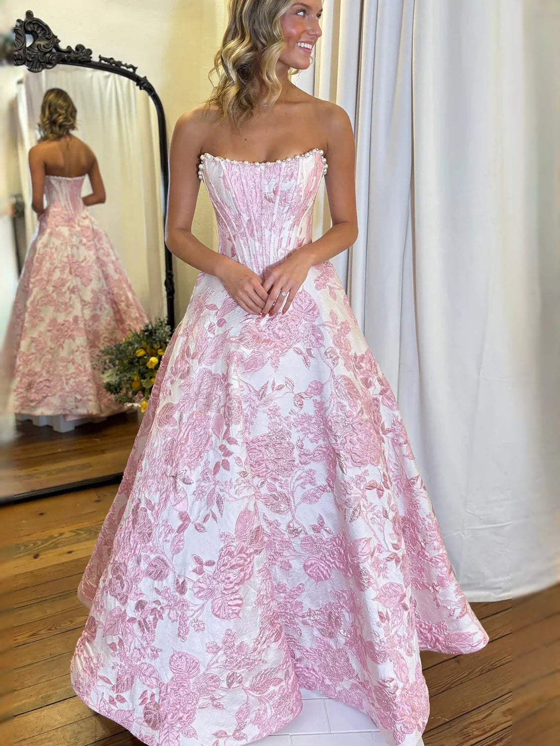 Blush pink corset sweetheart maxi prom dress with A-line floral satin skirt, side view