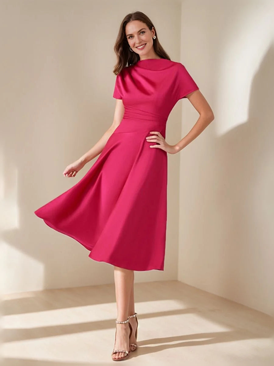 Hot pink satin A-line cowl-neck dress with draped skirt, short sleeves and ruched waist.
