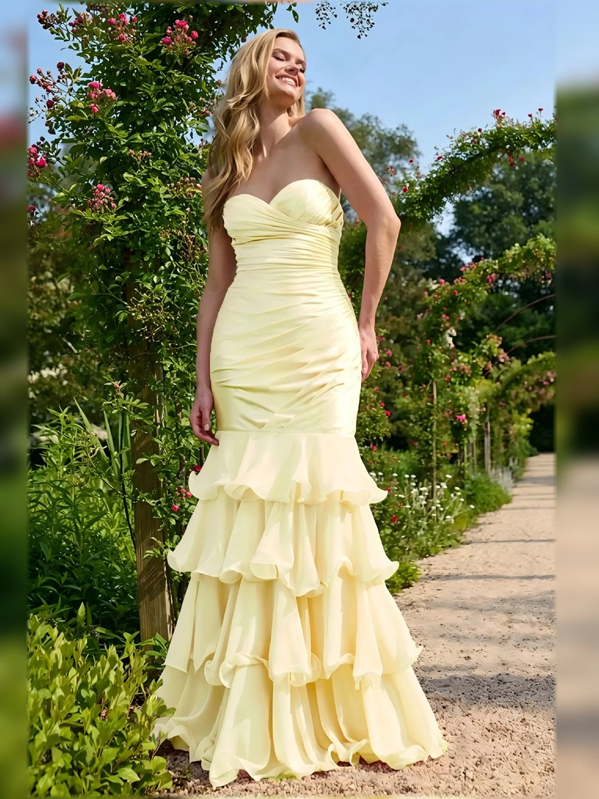 Pale lemon sleeveless sweetheart ruched gown with cascading tiered ruffles, floor length